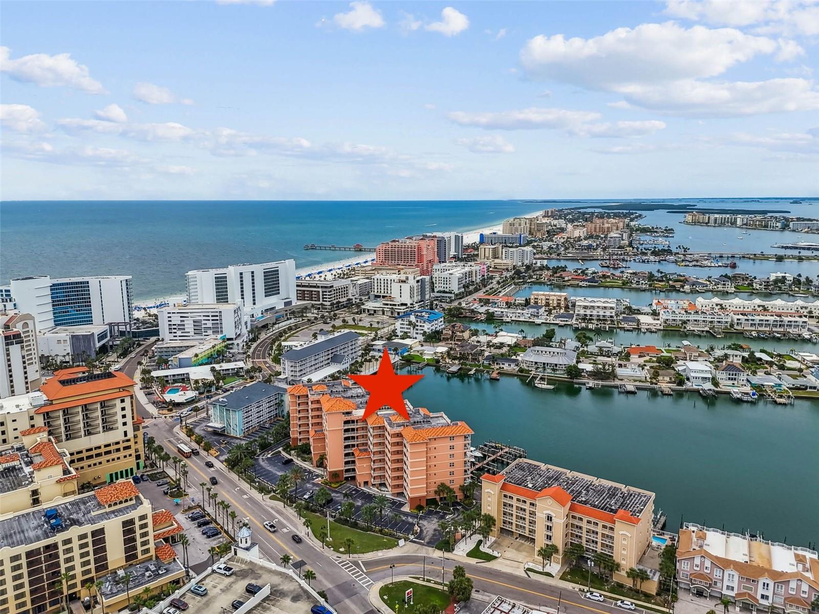Tropical coastal living at its finest in Clearwater Beach. Step into the laid-back luxury of this beautifully renovated 3-bedroom, 2-bath condo, just steps from the sugar sands of world-famous Clearwater Beach and a short drive or stroll over the bridge to Sand Key Park. Here, you’ll be immersed in the best of the beach—miles of pristine shoreline, endless water views, and vibrant sunsets right outside your door. Nestled in a gated community on the quieter side of Clearwater Beach, this residence offers both tranquility and convenience. You’ll be moments from casual seaside cafés, fine dining, boutique shopping, nightlife, boat charters, and the trolley stop right out front. Inside, the condo shines with a coastal-inspired décor and tasteful updates throughout—including a sleek renovated kitchen with LG stainless steel appliances and granite countertops, remodeled bathrooms, and new luxury vinyl plank flooring accented by custom tile. A GE Profile washer and dryer (2025) and newer AC (2019) provide peace of mind. The spacious primary suite features a large walk-in closet, while the kitchen boasts a roomy pantry. One of the highlights is the oversized waterfront balcony—over 200 sq. ft. of outdoor living space—perfect for morning coffee, evening cocktails, watching the boats glide by and dolphin sightings. Additional features include: a covered, dedicated parking spot plus ample guest parking. Sold turnkey furnished—move right in or enjoy rent-ready income potential with 7-day minimum rentals (ideal for investors). Flexible use as a primary residence, vacation retreat, or income property. Access to a community rec room with billiards, lounge, and dining spaces. This is more than a condo—it’s a slice of tropical paradise in one of Florida’s most coveted coastal destinations.