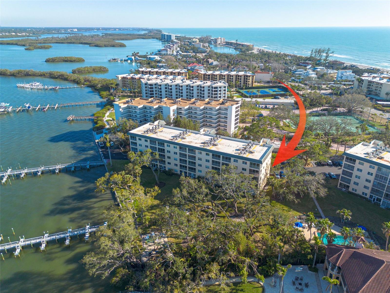 PRICE REDUCTION! This beautifully FULLY FURNISHED END-UNIT condo is a true gem, offering an abundance of natural light and a spacious, open layout. Featuring 2 bedrooms and 2 bathrooms, this home effortlessly blends comfort and style, making it the perfect space for both relaxation and entertaining. Step outside onto your private lanai and take in breathtaking views of serene Intracoastal waters—an ideal spot to unwind and embrace the peaceful surroundings. The primary bedroom features a walk-in closet and an en-suite bathroom for added convenience and comfort. The second bedroom is spacious, perfect for guests or family members alike. The kitchen boasts beautiful granite countertops, stainless steel appliances, and shaker cabinets with soft-close features, creating a sleek and functional cooking space. Located within a Gulf to Bay Community, this second-floor condo is just steps away from the pristine beach, which includes its own assigned storage cabana to stow your beach essentials, bikes, umbrellas, and chairs. Bay Tree community offers two heated pools, BBQ areas, kayak storage and fishing pier. For boating enthusiasts, the available boat slips provide easy access to the newly reopened Midnight Pass for all your water adventures. Fully furnished and with a STRONG rental history, this condo serves as an excellent income property—making it a fantastic choice for both vacation home seekers and investors alike. Equipped with HURRICANE IMPACT WINDOWS for added peace of mind and energy efficiency, this condo offers durability while maintaining a quiet, comfortable living environment. Additionally, the completed milestone inspection ensures transparency and confidence for the next homeowner. The monthly fees also cover a variety of essential services, including common area insurance, common area flood insurance, and an annual AC inspection and onsite Property Manager. Conveniently located near the free trolley stop, you’ll have easy access to explore Siesta Village’s restaurants, shops, and the world famous Siesta Key Beach with its white quartz sand. Don’t miss your chance to own a piece of paradise in one of Siesta Key’s most desirable locations. Whether you're seeking a vacation retreat, an investment property, or a coastal haven, this condo has it all! Schedule your showing today!