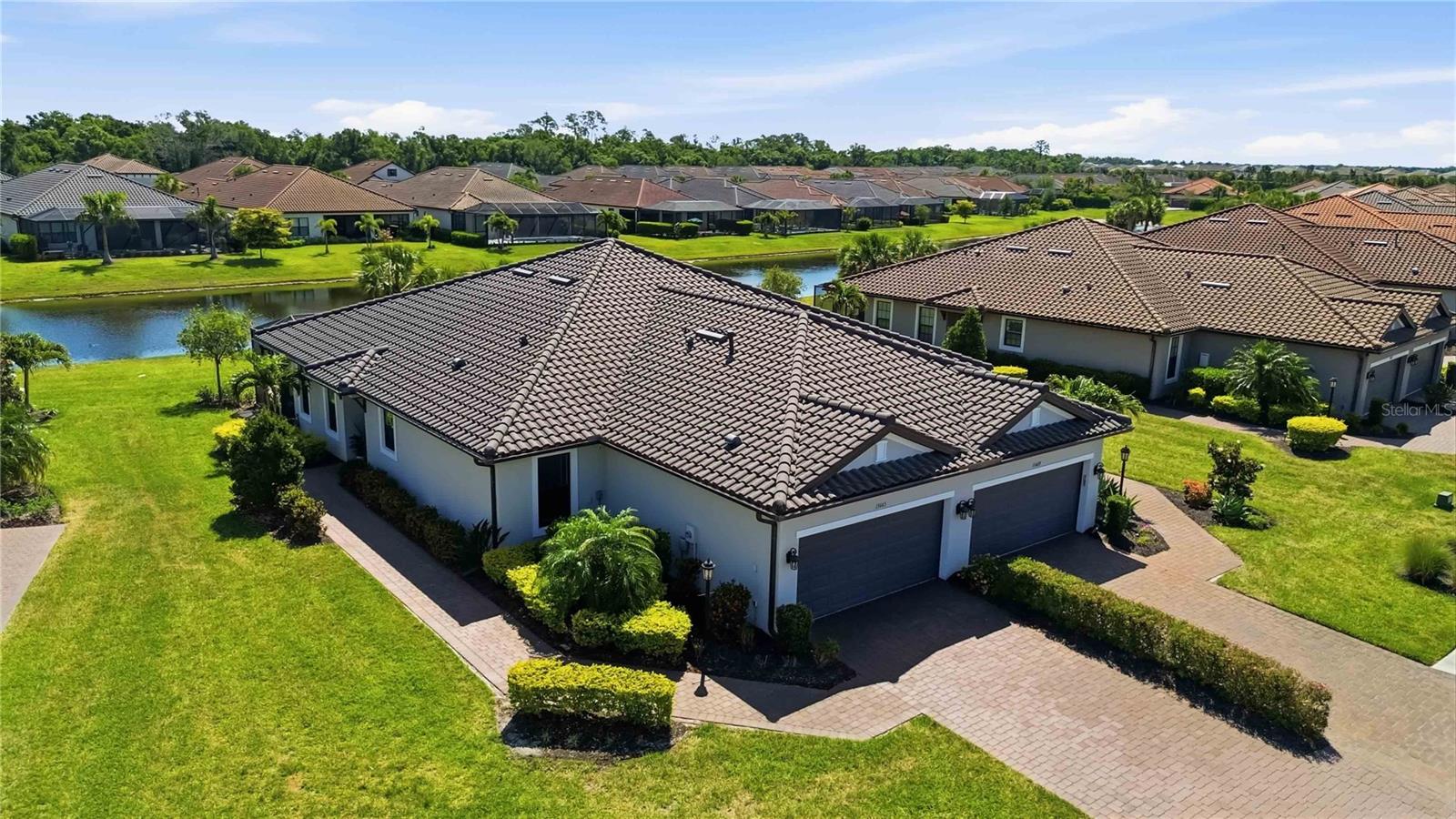 Motivated Seller. Experience elevated resort-style living in this beautifully appointed maintenance-free villa in the highly sought-after Esplanade at Azario in Lakewood Ranch. Perfectly positioned on a premium lakefront homesite, this residence captures serene water views, creating a private oasis right in your backyard.

Step inside to discover a light-filled, open-concept floor plan designed for both everyday comfort and effortless entertaining. The true highlight of the home is the expansive extended lanai, offering ample space for outdoor dining, lounging, and enjoying Florida’s year-round indoor-outdoor lifestyle. Whether you're hostiguests or savoring a quiet morning coffee, the peaceful lake views provide the perfect backdrop.

This maintenance-included villa allows you to spend less time on upkeep and more time enjoying the unparalleled amenities Esplanade at Azario is known for. Residents enjoy access to a resort-style pool, full-service clubhouse, on-site dining, fitness center, tennis, pickleball, and a vibrant social calendar curated by a dedicated lifestyle director. Golf membership opportunities are also available, adding to the community’s country club appeal.

Located in one of Lakewood Ranch’s premier gated communities, you’re just minutes from Waterside Place, top-rated dining, shopping, and the area’s world-renowned Gulf Coast beaches.

This is more than a home—it’s a lifestyle. Don’t miss your opportunity to own a slice of paradise in Esplanade at Azario.  Feature sheet and floorplan available.