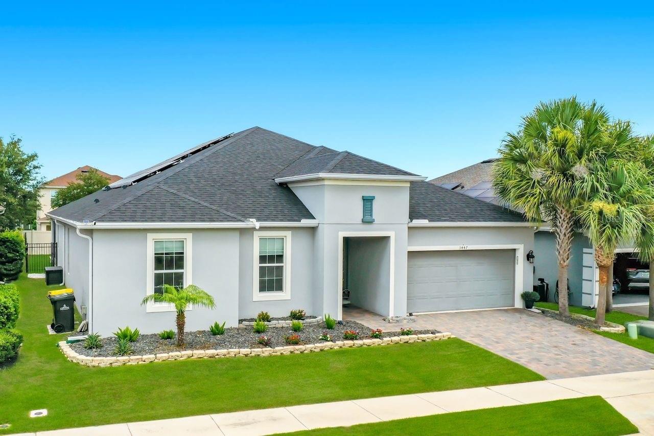 Experience elevated Florida living in this beautifully upgraded Lakeview Preserve home, where luxury, efficiency, and low-maintenance comfort come together seamlessly. Featuring a fully owned solar energy system complete with dedicated NEMA 14-50R for your EV, this thoughtfully enhanced residence offers exceptional value with no solar lease or financing to assume.

Inside, an open-concept design welcomes you with upgraded flooring, elegant tray ceilings, custom feature walls, and abundant natural light. The spacious living area is highlighted by a stylish electric fireplace, creating a warm and inviting gathering space. The gourmet kitchen is designed for both everyday living and entertaining, featuring luxury stainless steel appliances, ample cabinetry, and seamless flow into the dining and family rooms.

The private owner’s suite provides a relaxing retreat with a well-appointed ensuite bath, while the versatile floor plan offers flexibility for growing families, multi-generational living, remote work, or visiting guests.

Step outside to your own backyard oasis featuring premium artificial turf for year-round beauty without the upkeep. A dedicated area is perfectly manicured for putt-putt, bocce, corn hole and other outdoor games while retractable awnings and a lanai sunshade create the perfect setting for outdoor dining, entertaining, or relaxing evenings. Permanent exterior accent lighting adds curb appeal and convenience throughout the year.

Additional highlights include an extended two-car garage, luxury appliance package, and numerous owner-selected upgrades throughout.

Residents of Lakeview Preserve enjoy resort-style amenities including a community pool and cabana, splash pad, fitness center, playground, walking trails, and access to Johns Lake for kayaking, canoeing, and fishing. Conveniently located just minutes from Downtown Winter Garden, shopping, dining, top-rated schools, and SR-429, this home offers the perfect blend of tranquility and accessibility.

Rarely does a home combine energy efficiency, premium upgrades, and an exceptional lifestyle in one of Winter Garden’s most desirable communities. Schedule your private showing today.
