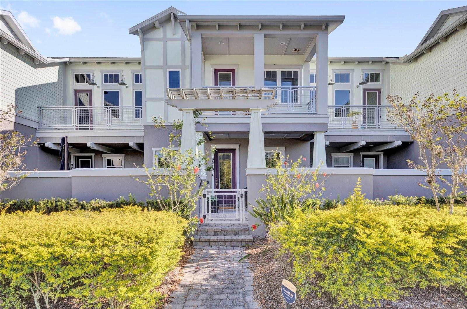 Welcome home to this beautifully designed townhome in the sought-after Laureate Park community at Lake Nona. The Minto-built Hartwell floor plan delivers 1,776 square feet of bright, open, and thoughtfully designed living space, offering 3 bedrooms, 2.5 bathrooms, and an attached 2-car garage.

At the center of the home, the kitchen is built for both everyday living and entertaining. It features rich cherry cabinetry, granite countertops, stainless steel appliances, and a generous center island with seating that flows seamlessly into the dining and living areas. The open main-level layout is enhanced by high ceilings, ceramic tile flooring, ceiling fans, and tasteful window treatments throughout, creating a warm and welcoming atmosphere from the moment you walk in. A convenient half bath completes the first floor.

Upstairs, the private primary suite serves as a relaxing retreat, complete with a covered balcony, an oversized walk-in closet, and a spa-inspired en-suite bath featuring dual sinks, a garden soaking tub, and a separate walk-in shower. Two additional bedrooms with built-in closets, a full guest bath, and an upstairs laundry room add everyday convenience, while a versatile loft offers flexible space ideal for a home office, media room, studio, or quiet reading nook.

Outdoors, the home is positioned across from a peaceful conservation lot for added privacy and scenic views. Enjoy a covered patio and a fully fenced courtyard, offering a low-maintenance space to relax, dine al fresco, or simply unwind at the end of the day. The attached 2-car garage provides additional storage and secure, convenient parking.

Living in Laureate Park means access to an exceptional, resort-style lifestyle. The HOA includes access to the community's renowned amenities. Residents enjoy the state-of-the-art Aquatic Center with multiple pools, an on-site restaurant, an event venue, fitness facilities, a clubhouse, community gardens, dog parks, playgrounds, and miles of tree-lined walking and biking trails that connect the neighborhood.

The location is second to none. You are just minutes from Lake Nona's Medical City, a thriving hub of hospitals, research institutes, and medical facilities, as well as Orlando International Airport, the USTA National Campus, premier shopping and dining, and major roadways including Narcoossee Road and SR-417 for quick and easy access to downtown Orlando, the theme parks, beaches, and everything else Central Florida has to offer.

This is a rare opportunity to own comfort, style, and an unmatched location in one of Lake Nona's most desirable communities. Schedule your private showing today and experience everything this exceptional townhome and its vibrant community have to offer.