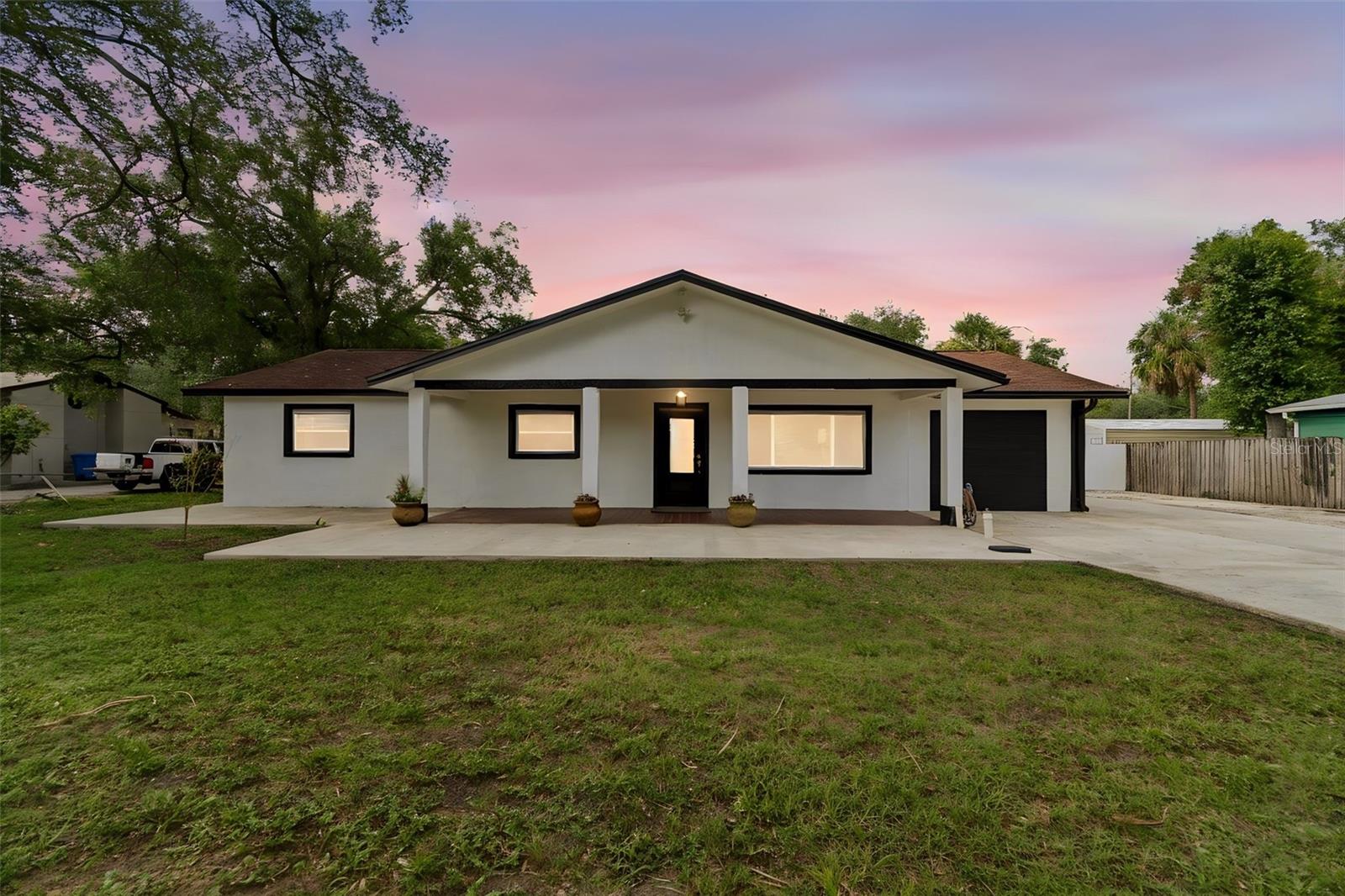 Discover the perfect blend of space, privacy, and flexibility with this rare South Tampa property situated on nearly an acre of land in a non-flood zone. Zoned Agricultural, this unique property offers endless possibilities, including growing crops, gardening, and other agricultural uses while still enjoying the convenience of city living. This well-maintained home features 3 bedrooms, 2 updated bathrooms, and a versatile bonus room that can be used as a home office, playroom, or additional living space. The finished garage provides even more flexibility and can easily be converted back into a functional garage if desired. The heart of the home is the spacious kitchen, complete with a large center island that's perfect for entertaining, family gatherings, and everyday living. The primary suite is a true retreat, featuring a cozy sitting area and an oversized walk-in closet. Both bathrooms have been beautifully updated with modern finishes. A generous utility room offers additional storage, making organization a breeze. Outside, you'll enjoy mature landscaping, beautiful shade trees, a storage shed, and expansive front and back yards with endless possibilities for outdoor living. The large paved driveway provides abundant parking and storage space for your boat, RV, trailer, work vehicles, and more. If you're looking for room to spread out without HOA or CDD restrictions, this exceptional South Tampa property offers the freedom, land, and lifestyle that's becoming increasingly hard to find.