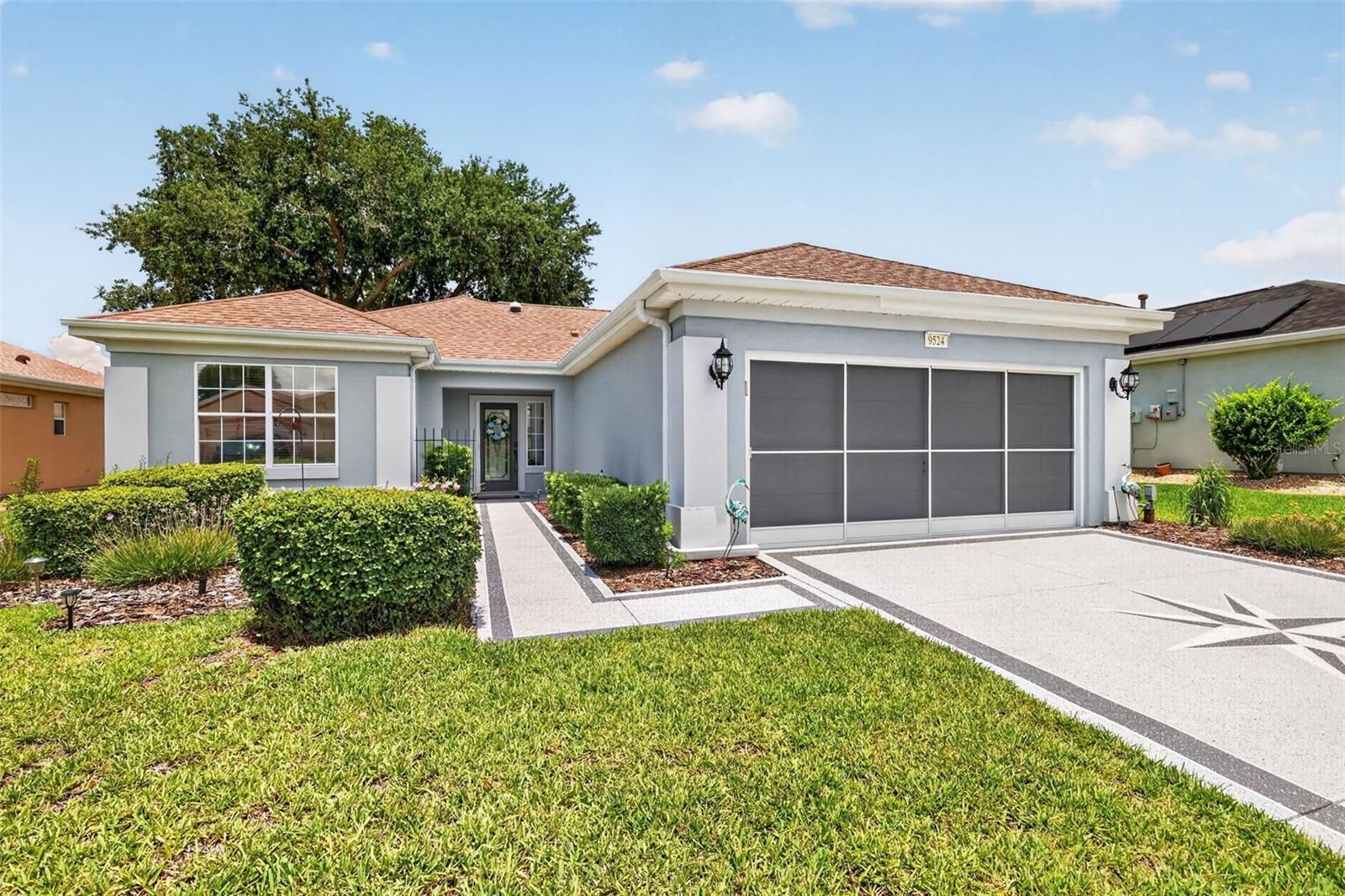 DON'T MISS this beautifully maintained Amelia floor plan located in the highly desirable 55+ golf community of Del Webb Spruce Creek Golf & Country Club! Great curb appeal with decorated driveway and landscaping.
This inviting 2-bedroom, 2-bath home features hardwood and ceramic tile flooring throughout—no carpet anywhere. The updated kitchen offers granite countertops, newer appliances, recessed lighting, and abundant workspace for cooking and entertaining.
Enjoy your morning coffee from your expanded enclosed lanai, or step outside into the large birdcage, providing exceptional indoor-outdoor living space perfect for relaxing, entertaining guests, or enjoying Florida's beautiful weather year-round.
Additional upgrades include a beveled glass front door with Phantom screen, two solar tubes for abundant natural light, laundry room cabinetry, tankless water heater, and a shared irrigation well to help reduce water costs.
Major improvements have already been completed, including a roof replacement in approximately 2014 and HVAC replacement in 2016.
Enjoy the resort-style lifestyle that Del Webb Spruce Creek Golf & Country Club is known for, featuring championship golf, indoor and outdoor pools, fitness center, pickleball and tennis courts, restaurant and pub, softball field, hobby and craft facilities, and hundreds of clubs and activities designed for active adults.
This move-in-ready home offers the perfect blend of comfort, functionality, and low-maintenance living in one of Central Florida's premier active-adult communities.
Schedule your private showing today and discover why so many residents love calling Del Webb Spruce Creek Golf & Country Club home!!