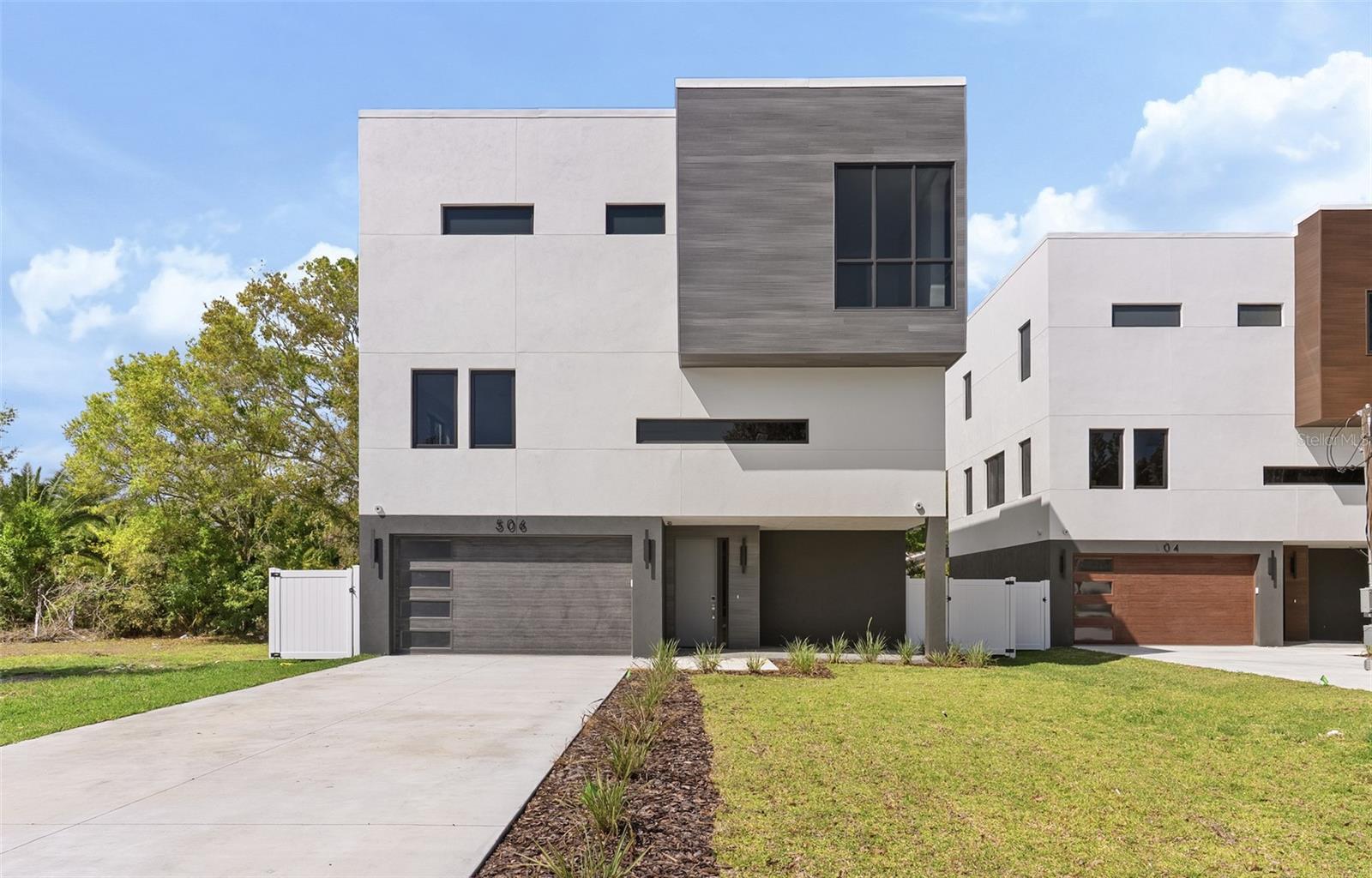 One or more photo(s) has been virtually staged. This stunning new three-story residence by Danva Construction perfectly blends modern luxury with resilient, high-end design. Located at 504 Federal Street in the desirable waterfront community of Oldsmar, this home is built for peace of mind with a solid concrete block structure, pilings, impact-resistant windows, and a durable TPO roof, all backed by a comprehensive builder warranty. The exterior is finished in Sherwin Williams Chantilly Lace, creating a clean, modern curb appeal enhanced by professional landscaping and a signature magnolia tree. Inside, the open-concept layout features soaring ceilings, porcelain tile flooring, and a gourmet kitchen that serves as a true showpiece. The kitchen is complete with a waterfall island, designer backsplash, and premium Bosch 800-series appliances. The luxurious primary suite offers a spa-inspired retreat with a freestanding soaking tub and porcelain tiled walls. Indoor-outdoor living shines with a second-floor porcelain tile balcony and a covered lanai. Note that some images are virtually staged to show the home's potential.  Secure a 1% rate buy-down when using our preferred lender, Revolution Mortgage. Perfectly positioned just one block from Tampa Bay and five minutes to Mobbly Bayou Beach Park, this home offers a lifestyle of privacy and convenience. Oldsmar is a charming waterfront community known for its parks and trails, with effortless access to Tampa International Airport (under 20 mins), Downtown Tampa (30 mins), and the world-famous beaches of Clearwater. The location is a true paradise for outdoor enthusiasts and urban commuters alike. You are steps away from the Upper Tampa Bay Trail, offering miles of scenic cycling and jogging paths. Just minutes away, the historic downtown Oldsmar district provides an array of boutique dining, local craft breweries, and community events like the annual Oldsmar Days. For shopping, the International Plaza and Bay Street are a short drive away, offering world-class retail experiences. Nature lovers will appreciate being adjacent to the Mobbly Bayou Wilderness Preserve, featuring over 400 acres of kayaking, hiking, and even a zip-line adventure park. Golfers can enjoy proximity to several championship courses including the nearby East Lake Woodlands Country Club. Whether you are catching a flight for business or spending a Saturday at Honeymoon Island State Park, this central location puts the very best of the Florida Gulf Coast right at your doorstep. This rare opportunity combines elevated finishes and resilient materials in a highly sought-after location.This rare opportunity combines elevated finishes and resilient materials in a highly sought-after location. All financing information is for illustrative purposes only and not a commitment to extend credit.