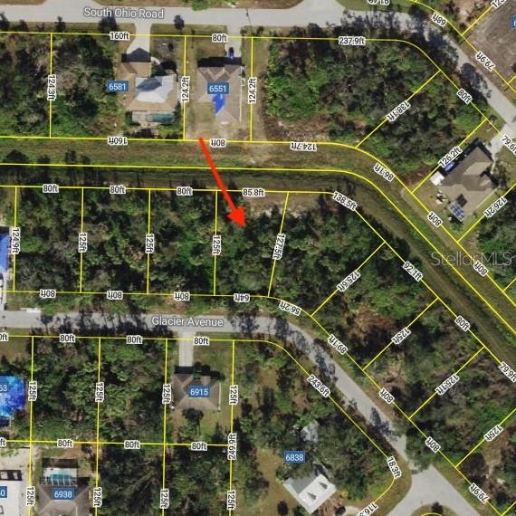 Build your dream home on this oversized 0.238-acre vacant lot in North Port, offering approximately 10,383 square feet of space and added privacy from the dry canal along the rear of the property. With city water and electricity available, this homesite provides a strong starting point for your future build. Located outside of a flood zone and, according to Sarasota County records, outside of the designated scrub-jay area, the property also has no HOA or CDD fees. Enjoy convenient access to nearby schools, shopping, dining, entertainment, golf, and the area’s beautiful Gulf Coast beaches. Warm Mineral Springs and Heron Creek Golf & Country Club are also just a short drive away. Whether you are ready to build now or looking to secure land for the future, this private North Port lot offers space, flexibility, and an excellent location.