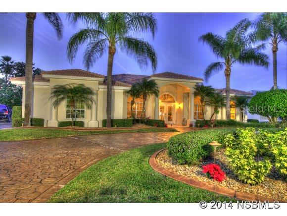 America's Premiere Fly-In, Gated, Country Club community; 4000' paved runway w/GPS approach & VASI lights; 24/7 roving security. Only min. to restaurants, shopping & theater; 15 min from World's Most Famous Beach, Daytona, 20 min to Embry Riddle Aeronautical Univ., 1 hour to Orlando & 3 hours to Miami. Gorgeous golf course home, meticulously maintained, located in the Country Club Estates subdivision w/ exceptional views of the 10th green & ponds.  Recent improvements include newer kitchen, pool & lanai area in 2009.  A/C units new 2012. Oversized circular concrete-stamped driveway, concrete block construction, barrel tile roof, 3-car garage, oversized back yard, screened in pool w/pavers, 4 bedrooms, 3 baths, 12 foot ceilings, Plantation shutters, 18" tile throughout except bedrooms, 5" baseboards, leaded glass front entry doors, open floor plan boasting arches, trey ceilings, extensive crown molding, great room w/entertainment center & coral stone fireplace, beautiful dining room with wainscoting paneling/double crown molding, eat-in kitchen w/solid counters, 42" cabinetry, gas range, laundry room w/splash tub, owners suite w/corner fireplace, owners bath w/walk-in shower, jetted tub, & double vanities & upgraded landscaping package. Located walking distance to the Country Club, golf, tennis, & fitness center. Furnishings available for sale. ;Water: City