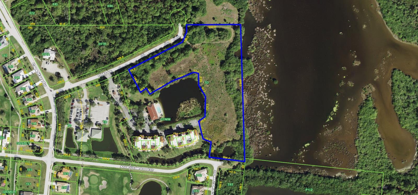 This 7.19 acre parcel is zoned CT which allows residential multi-family uses up to 15 units per acre maximum density or 107 units.  The potential for lower density development such as single family is available with 496 feet of paved road frontage and 868 fee of water frontage.  Development with 8 to 10 single family estate home sites is a viable option. It is difficult to describe how spectacular the view of the water and surrounding state owned preserve is from this site!  The site is located less than two miles from the Boca Grande Causeway and nearby gulf beaches.  The site sits on a non-navigable potion of Coral Creek that is an unbelievable wildlife preserve with incredible opportunities for kayaking, fishing and birding.  The peacefulness of this location cannot be overstated.