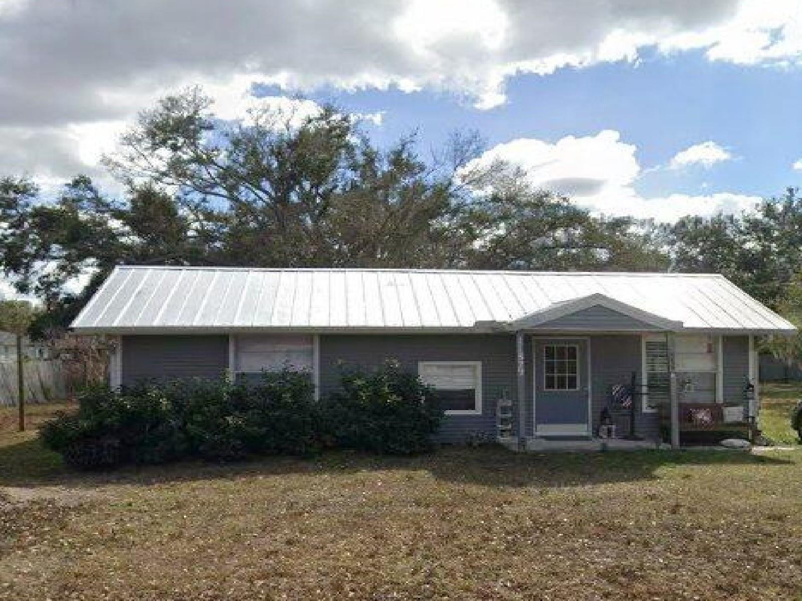 2/1 private bungalow on a half-acre (MOL) of beautiful tall, oak trees in a non-restricted neighborhood. No HOA! Got a work truck / trailer...no problem. Located on a dead end, asphalt street in the "Heart of Parrish". You get central A/C, county water and a septic system with this home that sits on a solid, concrete slab foundation. Nicely updated to include tile flooring, plantation shutter blinds, SS appliances and more. There is a separate washhouse with W/D hook ups. Plenty of yard for the BBQ events with plenty of shade. All the modern conveniences as new stores, restaurants, hospitals all building all around. Great for commuting as it has easy access to Hwy 301 and Ft Hamer Rd with I-75/I-275 just minutes away. Did I mention the beaches are the best in the world here? Tenant verification with criminal / credit check required. Available now. Pets considered by breed and number. Nonrefundable pet deposit required. First/last and security deposit required. Nonsmoking home. Owner is a real estate agent. Call / text for rental qualifications and application. Looking for an annual lease. Better hurry.