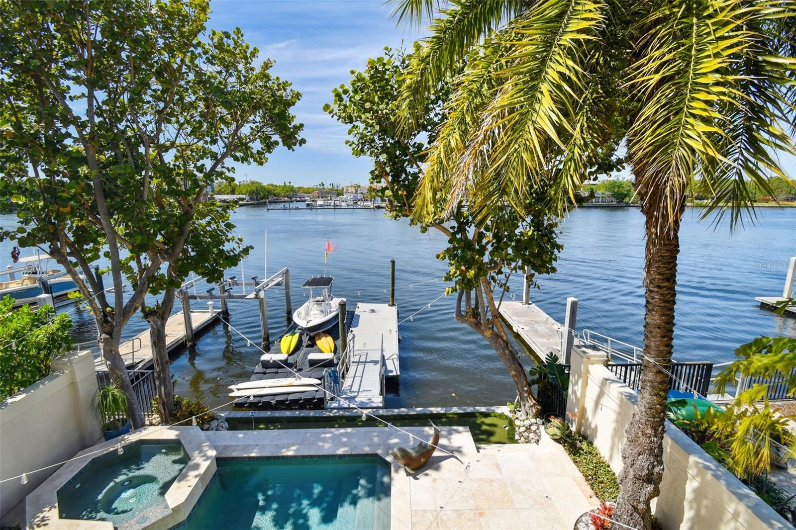 Welcome to the ultimate waterfront paradise in South Tampa, where luxury and coastal elegance meet. Nestled along the serene waters of Harbour Island, a 24-hour gated residential community near vibrant Downtown Tampa, this exceptional, One Owner, custom-built home offers breathtaking waterfront views, private dock and resort-style outdoor living, capturing the essence of Florida living! Breezing though storm seasons, you will find comfort in knowng there has been no flood nor wind damage!

Meticulously maintained by these original owners, you will sense a pride of ownership as soon as you step inside this custom designed home that features high ceilings and an open floor plan. A New Seawall was just completed and there will be a New Barrel Tile Roof installed shortly. Both were in good working order, but the owners felt it was time to replace. A great example of how well this home has been cared for! In additon the pool and patio were remodeled in 2022 with pool resurface, tile coping and travertine pavers all redone.

Currently, this home features three spacious bedrooms and three and a half baths, with the  original 4th bedroom being easily converted back from it’s current use as additional loft style living area and an oversized, storage closet. The coastal vibe is enhanced throughout the 2nd floor with the addition of beautiful, oil-rubbed, wood flooring. Each bedroom has an en-suite bathroom and spacious closets, as well.

As you enter through the double, french doors to your expansive primary suite, you are greeted by an anteroom, perfect for a home office, workout or nursery room. Adjacent is your generously sized walk-in closet and dressing room. This well designed suite has beautiful water views and is complete with a spa-like bathroom that includes a soaking tub, roomy, glass-enclosed shower, and double vanities with modern, lighted mirrors. Sliding glass doors lead you out to a private balcony overlooking the pool and the gorgeous waterfront below. 

The heart of this home is the chef’s kitchen, equipped with high-end appliances, including a new Wolf double oven, natural gas cook top stove, custom cabinetry, and a spacious island overlooking the family room with beautiful built-in entertainment center. In addition, there is a walk-in pantry with plenty of room for extra storage. Patio, pool and waterfront views abound throughout the entire space!

Rounding out the first floor are two separate dining areas and a large home office that provides a peaceful space for remote work. There is an oversized 2 car garage containing shelving for great storage for boating and biking toys and more!

Outside, the true allure of this home comes to life. A private dock with direct water access makes this a boater’s dream, offering the perfect launch point for days on the bay or cruising the Hillsborough River and Tampa’s waterfront.  

Beyond its stunning features, this residence is located in the renowned Gorrie, Wilson and Plant High School district. Just minutes from downtown Tampa, Channelside, Amalie Arena, museums, shopping, dining, luxury hotels, fitness centers, and day spas, everything you need is within easy reach. With proximity to the airport and major sporting events, this home offers the perfect blend of exclusivity and accessibility.


This waterfront gem offers it all, so don’t miss the opportunity to own a piece of paradise in one of Tampa’s most desirable neighborhoods! Call for your private tour.
