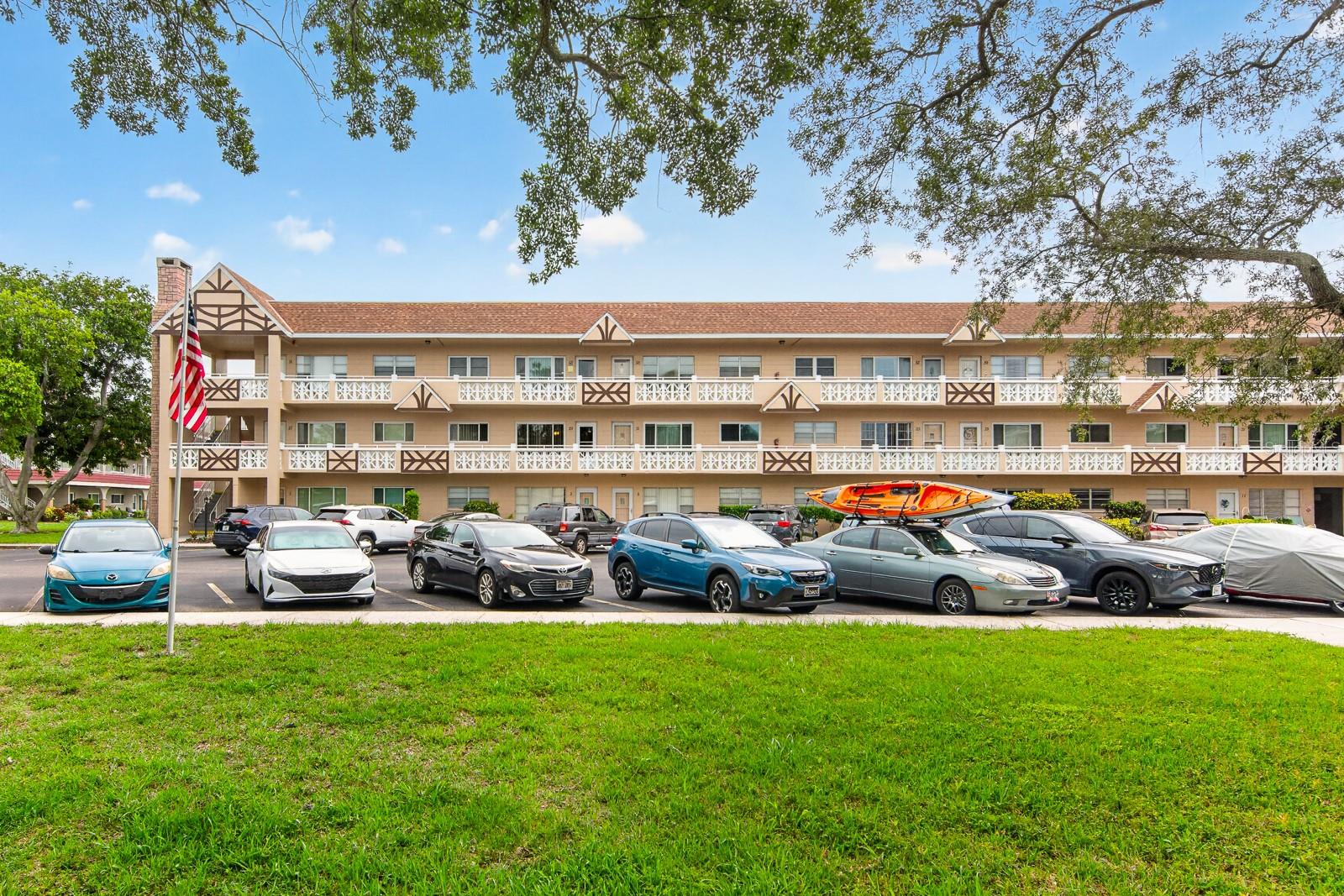 Welcome to one of the best opportunities in this highly desirable 55+ community. This spacious 2-bedroom, 2-bath, 1,100 sq. ft. unit offers a solid layout and generous room sizes, giving you the perfect canvas to bring your vision to life. The home is clean and well-kept, though it will benefit from a full remodel—an ideal chance to customize every detail to your taste. The floor plan includes a large living and dining area, a roomy Florida room with an additional storage closet, and two comfortable bedrooms with standard built-in closets. Shared laundry is conveniently located within the building, and the unit comes with one assigned parking space. What truly makes this property stand out is the unmatched lifestyle this community provides. Residents enjoy access to two pools, two private golf courses, tennis and pickleball courts, a woodworking shop, fitness facilities, over 100 clubs, and multiple activity centers—including an auditorium for shows, dances, and events. Scenic walking areas, paddle boats by the pond, and the on-site Good Karma Café add to the charm. Free bus service and close proximity to shopping, dining, and entertainment make everyday living easy and convenient. If you’ve been waiting for an affordable way to join a vibrant, amenity-rich community and create a home that reflects your style, this is the one. Schedule your showing today and explore the possibilities.