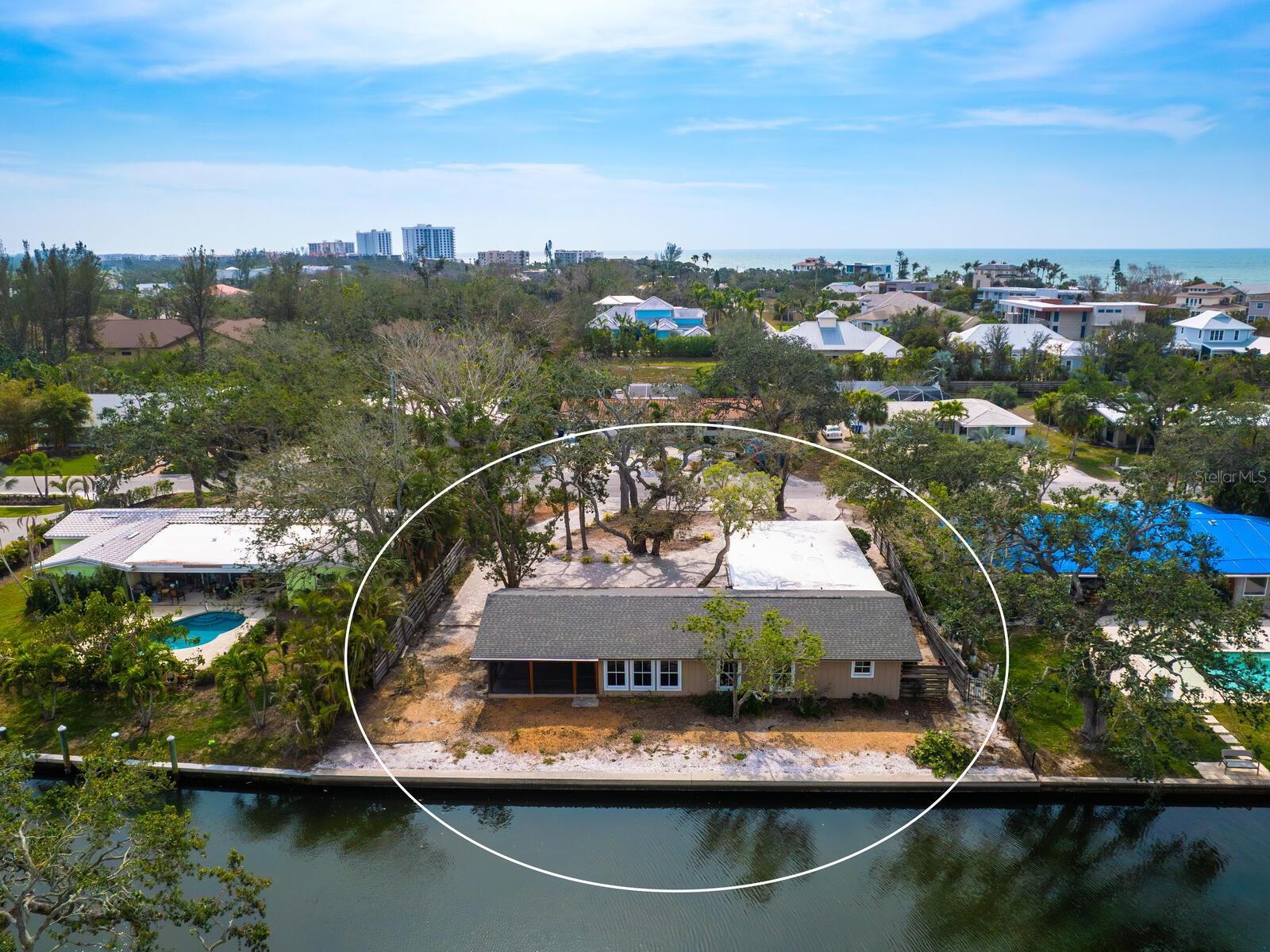 It's all about location. Just a short drive from Sarasota, Longboat Key offers unrivaled natural beauty in a coastal retreat. This home/land lot is a 1/3-acre with 100 feet of canal frontage on the desired south side of Longboat Key, and so close to the beach is about as good as it gets. The improvement can be inspected for remediation, and the generous lot features a healthy and substantial seawall on a private and quiet street, offering a golden opportunity for a luxury new build. Seller will offer house plans from a reputable LBK coastal builder, Brista Homes (plan buyer expense). The Buttonwood Community has been touted by the Longboat Observer as the neighborliest neighborhood on Longboat Key and is unique for having its safe harbor, boat ramp and boat slips up to 28 feet for its residents. Florida remains the envy of the country, with many of our markets winning awards for being among the best places to live or retire. It's all about connectivity. Sarasota SRQ Airport’s soaring success added 20 flights, 20% passenger growth, a new runway and terminal in 2024, ranks No. 1 for the fastest-growing airport in the U.S., and ranks No. 1 best resort airport in the entire country, where passengers can get off a plane and feel like their vacation has begun. It's all about investment. Beyond the numbers is the intangible and powerful increase in consumer confidence, which has always proven to enormously influence the housing market, especially luxury and second-home purchases. Longboat Key is the only barrier island on the West Coast of Florida to have relocated all overhead utilities underground for improved reliability and aesthetics, and LBK landed on the Forbes Travel Guide’s list of Top 12 Destinations for 2025. Gov. Ron Desantis announced February 20, 2026, another record-breaking year for tourism in Florida welcomed 143.3 million visitors throughout 2025. An estimated 33.5 million visitors as the highest fourth quarter for visitation on record. According to the release, Florida is the #1 domestic travel destination in the U.S. and a standout choice for international visitors.