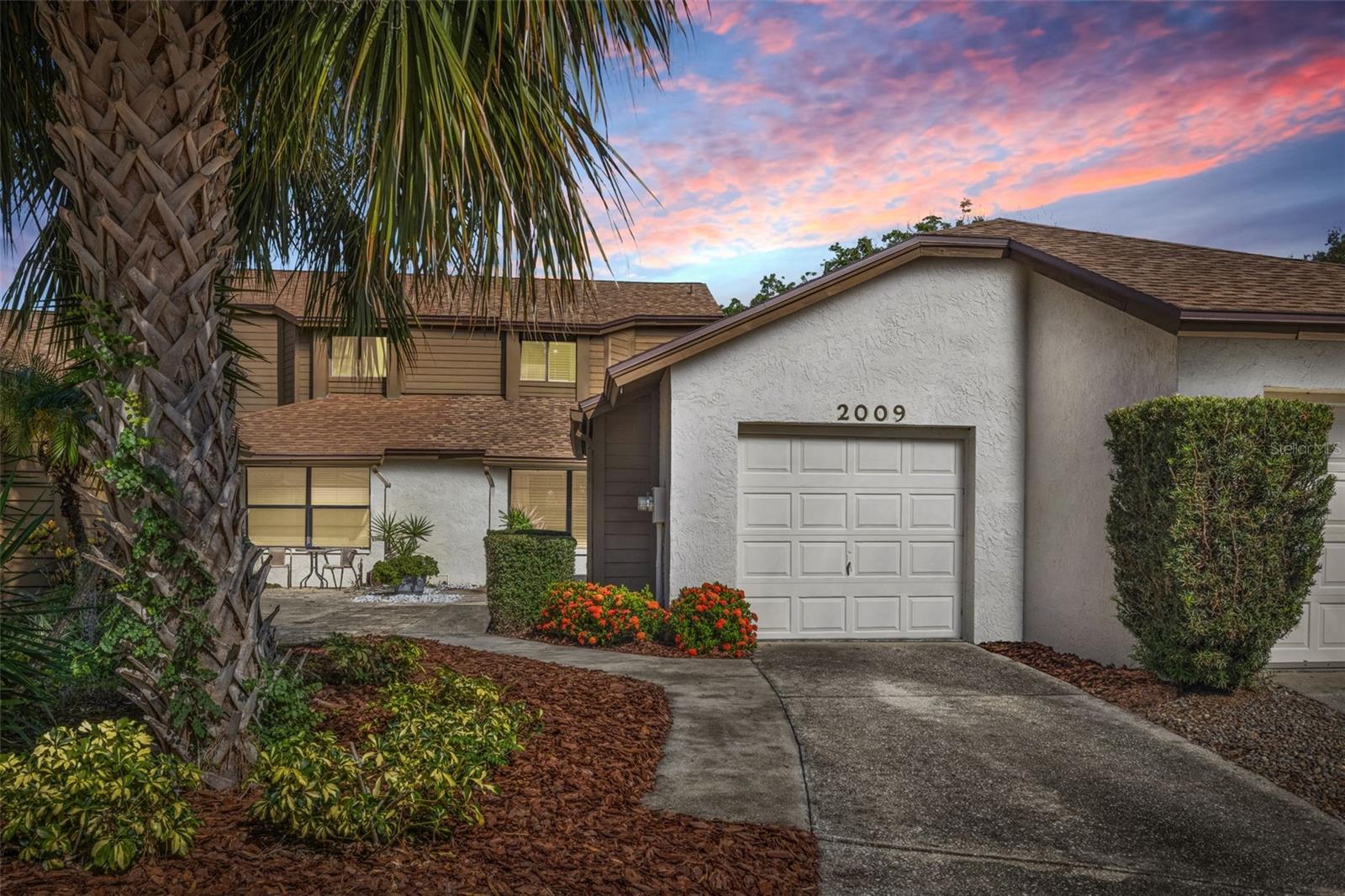Welcome to effortless living in one of Safety Harbor’s most sought-after communities. This beautifully renovated 3-bedroom, 2-bath townhome with a one-car garage combines stylish upgrades, thoughtful design, and an unbeatable location just moments from everything that makes Safety Harbor so desirable. The spacious FIRST-FLOOR PRIMARY SUITE offers the convenience of single-level living and features a spa-inspired ensuite with dual vanities, a luxurious walk-in shower, and a relaxing soaking tub. Throughout the home, you’ll find quality craftsmanship, including custom closet systems that maximize storage and organization. The heart of the home is the stunning kitchen, designed for both everyday living and entertaining. Premium granite countertops, an oversized center island, custom cabinetry with soft-close drawers, and abundant workspace create a functional yet elegant gathering place. A tankless water heater adds efficiency while freeing up valuable storage space. The inviting living area is anchored by a charming wood-burning fireplace, creating a warm and comfortable atmosphere. Both bathrooms have been tastefully remodeled with high-end finishes and timeless design. Step outside to an expansive wood deck overlooking acres of open green space, providing a peaceful setting for morning coffee, outdoor dining, or simply enjoying Florida’s beautiful weather. Residents enjoy exclusive private access to Philippe Park, one of Pinellas County’s most treasured waterfront parks, offering scenic walking and biking trails, kayaking, boating, fishing, picnic areas, and abundant natural beauty. Community amenities also include a swimming pool, tennis courts, and recreational areas. Just a short bike ride away, vibrant downtown Safety Harbor offers an exceptional mix of locally owned restaurants, boutique shopping, craft breweries, live entertainment, and year-round community events. The nearby Safety Harbor Marina features boat slips, a fishing pier, waterfront walking paths, and outdoor gathering spaces overlooking Tampa Bay. Conveniently located between Tampa and St. Petersburg, you’ll enjoy easy access to Tampa International Airport, St. Pete-Clearwater International Airport, major highways, world-class beaches, shopping, dining, and everything the Tampa Bay area has to offer.