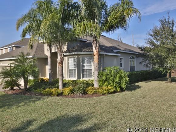 Shows like a model and new home in the desirable golf community of LPGA International. Situated on a corner lot backing to preserve, this one owner 4 bedroom 3 bath home with 3 car garage has been extremely well maintained.  A welcoming foyer entry leads into the open concept floor plan that is perfect for entertaining.  Over 10 foot volume ceilings, decorative lighting, architectural details, trey ceilings and lots of tile are just some of the designer touches throughout. The kitchen is appointed with dark granite countertops, upgraded wood cabinets and Kenmore stainless steel appliances with breakfast bar open to casual dining area and family room. Glass sliders lead from the family room out to the large covered lanai and overlook the preserve and private backyard. The spacious master suite also has sliders to lanai, a luxurious master bath with double sink vanity, garden tub and tiled shower plus customized walk-in closet. Two additional bedrooms with another full bath are tucked away from main living area.  Inside utility room leads to nearly 600 SF 3 car garage. A den or 4th bedroom with attached full bath is just off entry foyer. A great location just inside the entrance and near the clubhouse, restaurant and more. LPGA Intl is convenient to I-95, I-4, minutes to the beach, airport and shopping. One year AHS Home Warranty to buyer. ;Water: City