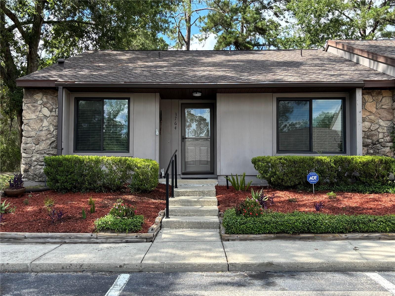 Come see this Move in ready, end unit, open  floor plan condo in Mile Run. Two bed, two bath split plan condo. Stainless steel appliances, upgraded skylights. Large back patio that can be converted with windows for a four season room. ( Seller has window panels). Large utility room attached to patio, washer and dryer stay with the home. Large walk in closet in Main bedroom and large closet for ample storage in secondary bedroom. Private shower/toilet in main bedroom/ bathroom. Wood laminate flooring in main rooms and bedrooms. Tile in kitchen and baths. Vaulted ceilings throughout for a light and spacious feel. Newly landscaped front lawn, private and quiet end unit with a bridge to the walking path. Path leads to the pool, playground, Tennis courts, racquetball courts and club house. Possum creek trail  and skate park is just across the street. Publix is at the corner of 43rd ST and 53rd AVE. Restaurants/ Ace hardware, location is prime! Call for a showing today!
