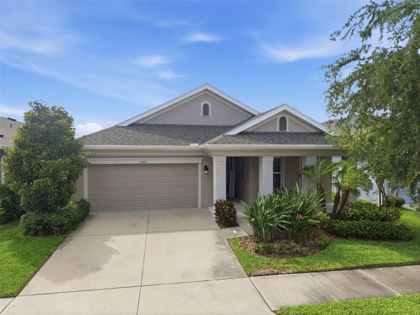Beautifully upgraded and built in 2019, this 4-bedroom, 3-bath pool home in the highly sought-after Waterset community offers the perfect blend of luxury, comfort, and privacy. The open-concept floor plan features wood-look tile flooring, abundant natural light, and a stunning chef’s kitchen with quartz countertops, upgraded cabinetry, designer backsplash, built-in wall oven and microwave, gas cooktop, stainless vent hood, and an oversized island overlooking the spacious living and dining areas. The private owner’s suite includes a beautifully upgraded bath with dual vanities and a large walk-in shower, while the additional bedrooms provide plenty of space for family, guests, or a home office. Step outside to your own backyard retreat featuring a screened lanai, heated saltwater pool with sun shelf, premium pavers, lush tropical landscaping, and peaceful conservation views with no rear neighbors. Located in Waterset, residents enjoy access to resort-style pools, fitness centers, parks, playgrounds, trails, and community events, all just minutes from shopping, dining, and easy access to Tampa, St. Petersburg, and MacDill Air Force Base.