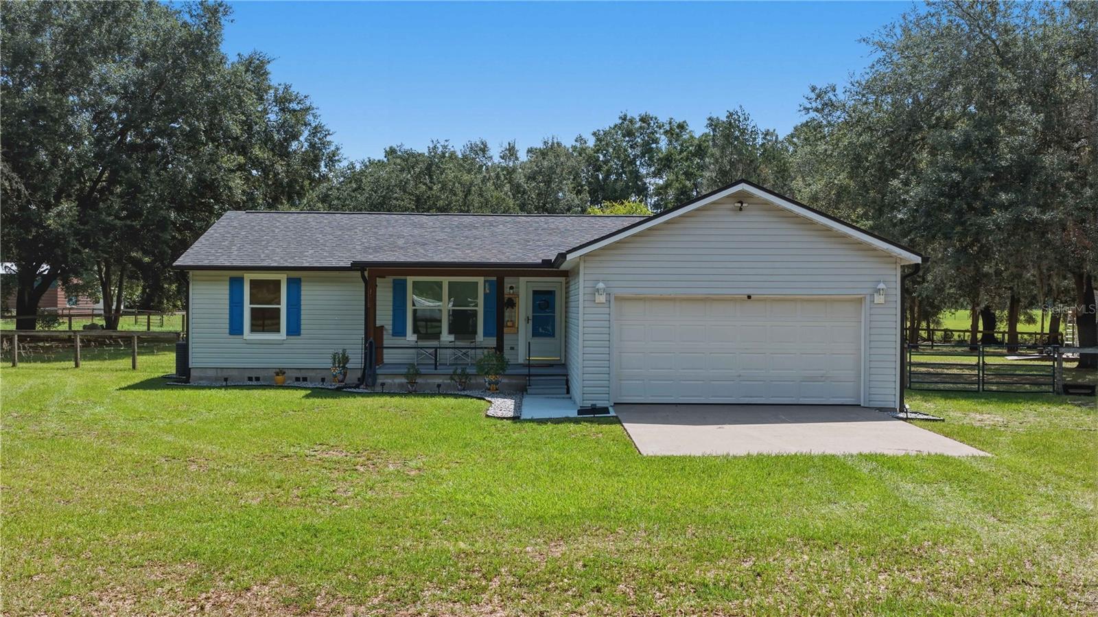 Don't miss the opportunity to own this meticulously maintained 3-bedroom, 2-bath modular home featuring a desirable split-bedroom floor plan on nearly 2 peaceful acres. Zoned A-1, this exceptional property offers the perfect blend of country living while remaining just minutes from shopping, medical facilities, dining, and The Villages.
Originally planned as the owners' forever home, this residence showcases quality craftsmanship and thoughtful upgrades throughout. The fully fenced property features a combination of three-board and top-board no-climb fencing, making it ideal for horses, pets, or anyone seeking privacy and room to roam.
Step inside to discover a bright, open-concept living space with vaulted ceilings, beautiful luxury flooring, 5½-inch baseboards, fresh interior paint, and abundant natural light. A spacious screened rear porch provides a wonderful place to relax, entertain, or simply enjoy Florida's beautiful weather year-round.
The completely renovated kitchen is the centerpiece of the home, featuring gorgeous quartz countertops, custom cabinetry, brand-new stainless steel appliances, and a convenient coffee bar great for morning routines or entertaining family and friends.
Both bathrooms have been tastefully updated with quartz countertops, while additional upgrades include new double-pane windows with a transferable warranty, stylish window treatments, new ceiling fans, gutters, and countless other quality improvements throughout the home.
For added peace of mind, the home also features a new roof installed in November 2023 and a transferable termite bond.
Whether you're hosting family and friends, enjoying quiet evenings on the screened porch, or taking advantage of the open acreage, this move-in-ready property offers exceptional comfort, style, and functionality. With extensive upgrades and meticulous attention to detail, this is a home that truly must be seen to be fully appreciated.