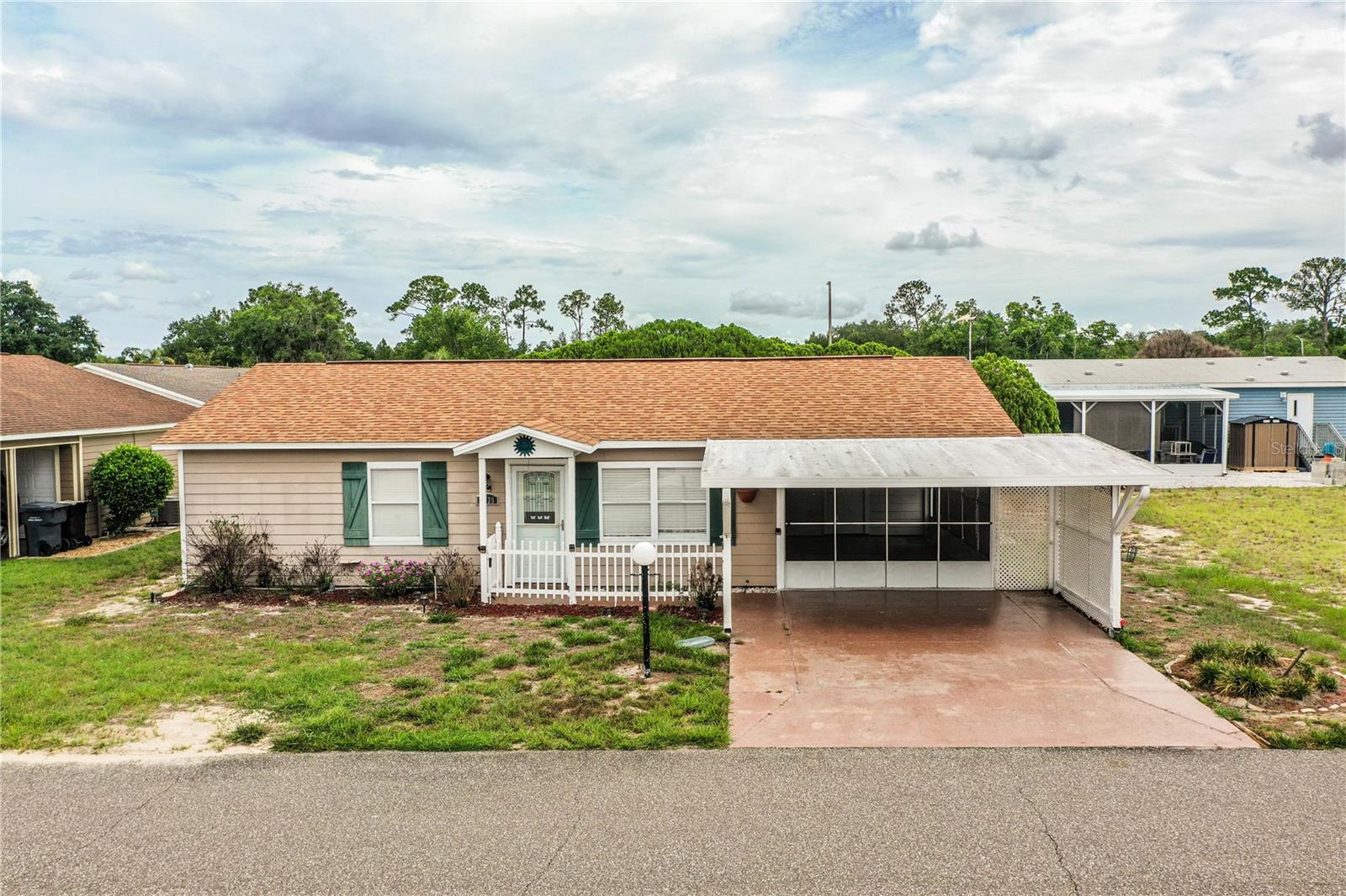Welcome to 4235 Cerimen St. in Lake Wales, nestled within the peaceful setting of Nature’s Edge Resort, a 55+ community. This well-maintained home offers 2 bedrooms, 2 bathrooms, and two versatile bonus spaces designed to fit your lifestyle.
Enjoy added living flexibility with the enclosed rear patio, complete with a mini-split system for year-round comfort. Currently used as a dining area, this space can easily serve as a hobby room, office, or additional lounge. A spacious front screened porch provides the perfect spot to start your morning with coffee or unwind and connect with neighbors in the afternoon.
Both bedrooms feature comfortable carpeting and walk-in closets, offering ample storage. The home is equipped with storm shutters for added convenience, the roof is approx.8 years and the HVAC system is approximately 5 years old. There is a well, for irrigation only. Property offers two sheds for additional storage and a covered carport large enough for two vehicles.  
Residents of Nature’s Edge Resort enjoy access to a variety of amenities, including a clubhouse, shuffleboard court, fitness center, horseshoe pit, swimming pool, and a designated dog park.
Conveniently located in Central Florida, this property offers access to a variety of outdoor and recreational opportunities. Nearby, you can explore local dining, scenic gardens, and freshwater lakes known for fishing and nature activities.
This home presents a wonderful opportunity to enjoy comfortable living in a welcoming community setting.
*info on Polk County Appraiser's website is incorrect to include number of bathrooms and sq footage*