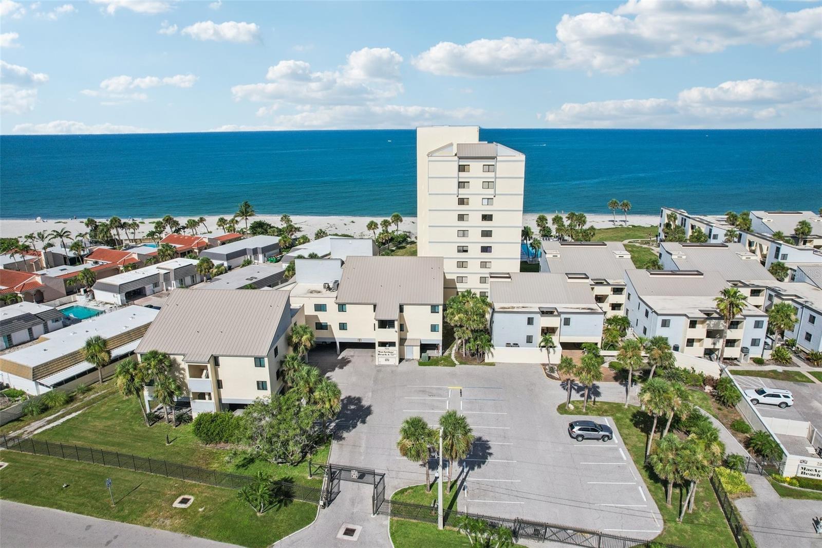 MOTIVATED SELLER! ALL REASONABLE OFFERS WILL BE CONSIDERED!  Experience coastal living at its finest with this 1BR/1BA beachfront condo on the Gulf of America, in the highly sought after MacArthur Beach & Racquet Club on Venice Island! Whether you're seeking a tranquil beach retreat, a full-time residence, or an investment property, being Only steps away from the beach, its perfect for enjoying Gulf breezes and Florida sunsets. This move-in ready condo has a modern kitchen, and the convenience of an in-unit stackable washer/dryer. The spacious bedroom also includes a custom Closet. Brand new Air conditioner and condenser were installed in 2025. This is a pet-friendly, gated community, with wonderful ammenities including: Heated community pool, Tennis and Pickleball courts,  Clubhouse, Library and Covered/uncovered parking. Located just minutes from historic downtown Venice, this property offers easy access to beautiful gulf coast beaches, dining, shopping, entertainment, and scenic walking and biking paths. Live the beachfront lifestyle you’ve always dreamed of — schedule your private showing today!