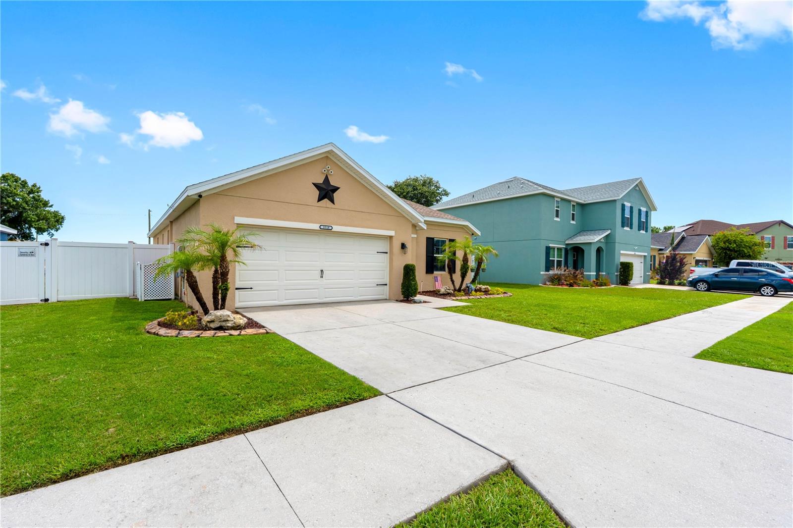 Impeccably maintained home in Magnolia Green.  This 3 bedroom, 2 bathroom, two car garage home awaits its new owners.  Step through the front door to sparkling stained concrete floors in the main living areas.  The master bedroom and two secondary bedrooms have carpeted flooring with ceramic tile in the two bathrooms.  The master bathroom is equipped with a blue tooth exhaust fan. This open floor plan home has a kitchen, with a nearly new dishwasher and microwave, that opens up into the dining area and great room. Great room features include a masterfully designed rustic wood accent wall and a built- in nook.  Sliding glass doors open to an open air covered 12 x 20 concrete slab floor with a RV/Camper hookup and an additional connecting 20' concrete pad. The yard is completely fenced with vinyl fencing and a double gate. For added outdoor privacy there are no backyard neighbors.  The ROOF was replaced in 2025 and offers a transferrable Warranty. The HVAC system has been continuously maintained, most recently in late May of 2026.  With a low quarterly HOA fee, NO CDD, two playgrounds and a community pool, Magnolia Green is the perfect place to call home.  Schedule your appointment to see this beautiful home today!