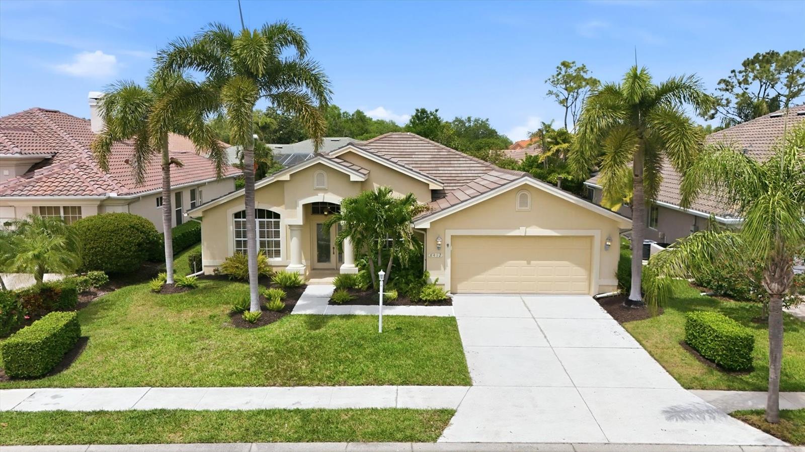 Now Fully-Furnished and Move-in Ready! Welcome to your private paradise behind the gates of Edgewater Village in Lakewood Ranch, where thoughtful updates, comfort, and wellness blend seamlessly. This beautifully updated 4-bedroom, 2-bath residence offers an open, light-filled floor plan enhanced by stylish luxury vinyl flooring that flows throughout the home. The heart of the home is a stunning, fully remodeled kitchen featuring solid wood cabinetry, quartz countertops, stainless steel appliances, a gas range with hood, and abundant workspace. Designed for both entertaining and everyday living, the kitchen opens effortlessly to the family room and casual dining area, creating a warm and inviting gathering space. Step outside and discover your own resort-inspired retreat. The screened extended lanai showcases a heated Mineral Ionization pool—an advanced, health-conscious alternative to traditional chlorine systems, complete with a tranquil (lighted) cascading waterfall and a dramatic fire pit feature, creating the private setting for relaxation or entertaining. The spacious primary suite serves as a peaceful sanctuary, offering a large walk-in closet, dual vanities with marble countertops, a luxurious soaking tub, and a separate walk-in shower. A thoughtfully designed split-bedroom floor plan provides privacy for family and guests, with two guest bedrooms tucked behind a stylish barn door. The fourth bedroom, featuring direct lanai access via glass doors and plantation sliders, offers exceptional flexibility as a guest suite, home office, or den. What truly distinguishes this home is its emphasis on healthy living. Carefully curated features include low- and no-VOC paints, a reverse osmosis water filtration system, and an eco-friendly, chlorine-free pool environment, creating a home designed with wellness in mind. Additional highlights include, newer TILE ROOF in 2019, NEW pool heater and pump (2026), high ceilings with crown molding, plantation shutters, updated ceiling fans and central vacuum system. Ideally located just off University Parkway, Edgewater Village places you minutes from Lakewood Ranch Main Street, Waterside Place, UTC Mall, I-75, downtown Sarasota’s vibrant arts and cultural scene, St. Armands Circle, and the world-famous beaches of Siesta, Lido and Longboat Keys. With an exceptionally low HOA fee of just $150 per year, this home offers an extraordinary blend of luxury, location, and lifestyle. If you’ve been searching for a well-built home that truly stands apart, your search ends here. Schedule your private showing today.