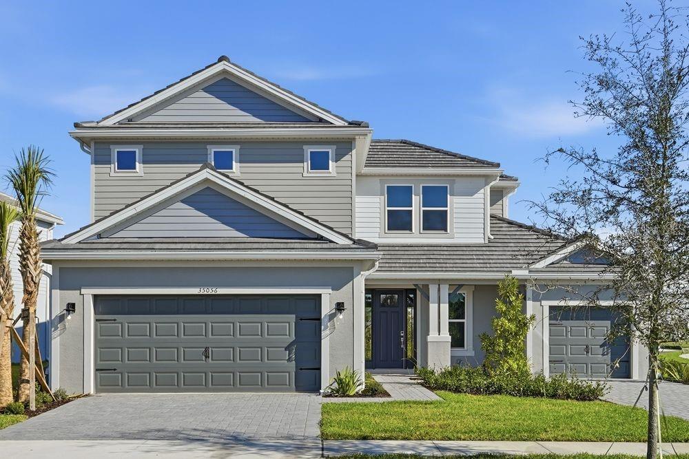 What's Special: Corner Lot | 1st Floor Guest Suite | Covered Extended Lanai | Gourmet Kitchen | Pond View. New Construction - Ready Now! Built by America's Most Trusted Home Builder. Welcome to the Tortola at 35056 Emberview Drive in Hammock at Two Rivers! This stunning new home makes a bold first impression with its soaring two-story foyer. Just off the entry, you’ll find a half bath, laundry room, and a private secondary bedroom with its own en-suite, perfect for guests. At the heart of the home, the open-concept gathering room features oversized sliding glass doors that lead to a sunny lanai, creating the ultimate indoor-outdoor living experience. The spacious gourmet kitchen overlooks this area and includes an elongated island with a stainless steel apron-front sink, stylish pendant lights, a walk-in pantry, and plenty of counter space for meal prep. A cozy dining area completes the space. The main-level primary suite offers a spa-like bath and a generous walk-in closet for your retreat. Upstairs, you’ll find three secondary bedrooms, one with a private en-suite, another full bath, and a large game room for fun and relaxation. Step into Hammock at Two Rivers—a resort-style private social club designed for elevated living. This planned, member-only haven will feature a premier health club, racquet sports, spectacular pool, and more. Savor a meal with neighbors at the planned fine dining restaurant or enjoy a staycation at the poolside bar. Other planned amenities include a playground, lap pool, event lawn, and a slide tower for endless fun. Beyond the community, Zephyrhills offers small-town charm with easy access to Tampa and Orlando. Explore local dining and shopping, cheer on major sporting events, or spend the day at nearby theme parks and beautiful beaches like Sunset Beach and Clearwater Beach. There’s so much to discover! Additional Highlights Include: Gourmet kitchen, pocket slider at great room, extended lanai, bar in great room, 8' interior doors, door at game room, and tray ceiling at great room, primary suite, and foyer. MLS#TB8457119