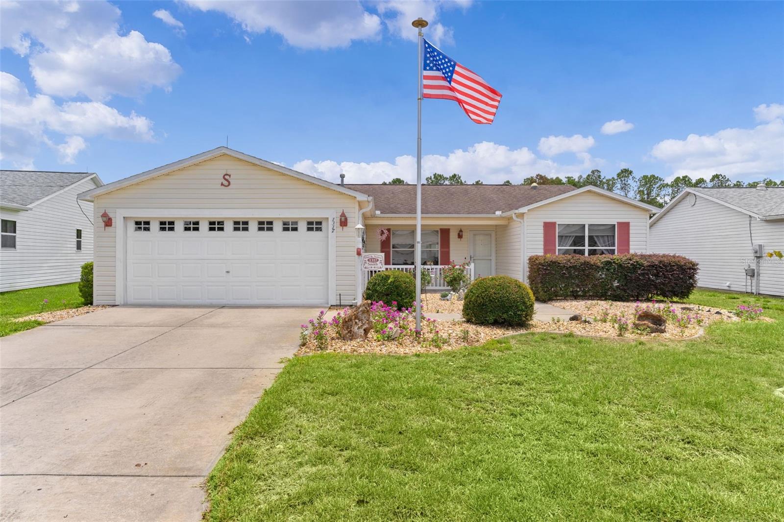 ~NO BOND~ ~2018 ROOF~ ~2023 HVAC~ ~2015 HOT WATER HEATER~ ~FLORIDA ROOM~
Welcome to this beautifully maintained CAROLINA III model in the desirable Village of SANTIAGO, offering comfortable living, thoughtful updates, and inviting indoor-outdoor spaces. Charming wildflowers greet you in the front yard, adding to the home's curb appeal and character.
Step inside the NEW SCREEN DOOR to find SOARING VAULTED ceilings and LAMINATE flooring that flows from the entryway throughout the main living areas. The bright and welcoming living room features a ceiling fan and an open layout ideal for entertaining. The updated kitchen boasts beautiful QUARTZ countertops, an ACCENTED TILE backsplash, BREAKFAST BAR which includes the same tile backsplash, and ample workspace for preparing meals and gathering with family and friends. All appliances are 1-2 years old!
The dining area is enhanced by a SOLAR TUBE that fills the space with natural light and features FRENCH DOORS leading to the FLORIDA ROOM. This versatile space is under heat and air and offers LAMINATE flooring and a ceiling fan, creating the perfect spot to relax year-round while enjoying views of the backyard and birdcage. The spacious primary suite features LAMINATE flooring, a ceiling fan, WALK-IN closet, and an ensuite bath with linoleum flooring, tub/shower combination, linen closet, and SOLAR TUBE. The guest accommodation provides comfort and privacy, with the 2nd bedroom offering LAMINATE flooring, a ceiling fan, and built-in closet. The guest bath includes PORCELAIN TILE flooring, a WALK-IN shower, linen closet, and SOLAR TUBE. The 3rd bedroom features LAMINATE flooring, a ceiling fan, and built-in closet, making it ideal for guests, hobbies, or a home office. Just off the FLORIDA ROOM is a spacious BIRDCAGE that provides the perfect outdoor setting for enjoying Florida's beautiful weather. Additional highlights include an INSIDE L AUNDRY ROOM with Kenmore washer and dryer plus built-in cabinetry for storage. The 2-car garage is equipped with a laundry tub, ceiling fan, 2 sets of attic stairs, and attic decking for abundant storage. You are close to the El Santiago postal station as well as the El Santiago Pool & Rec Center. Just minutes away from the Savannah Center and the Glenview Country Club too.  And as far as shopping, dining and medical, you are close to US441 and CR466. This Carolina model is ready for you to move in and start enjoying everything this vibrant community has to enjoy.
