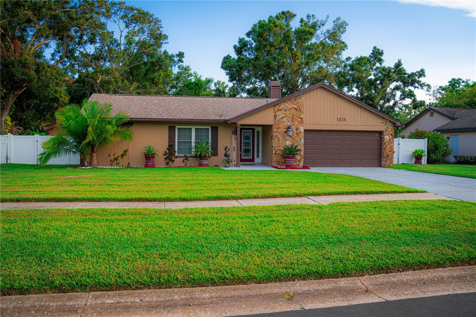 Turnkey Daycare Opportunity & Beautiful Residence in Pinellas Park! Rare find! This versatile 3-bedroom, 2-bathroom home features a fully licensed, professional daycare facility (converted garage) with a 10-child capacity. Perfect for an owner-operator looking to work from home or an investor seeking a property with a built-in income stream. The residence boasts a modern kitchen with granite countertops, stainless steel appliances, and elegant cabinetry. Enjoy a spacious living area with stylish wood-accent walls and a cozy fireplace. The outdoor oasis is equally impressive, featuring a large screened-in patio with a hot tub, a lush backyard with a storage shed, and a dedicated outdoor play area for children. Situated in a quiet neighborhood with great curb appeal, this is a one-of-a-kind opportunity