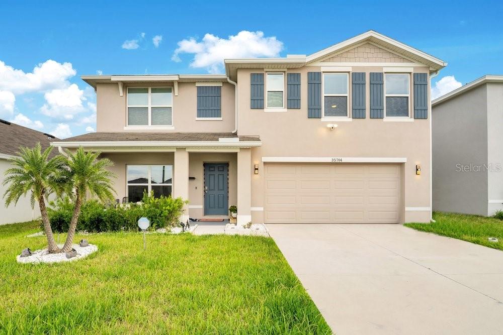 Welcome to 35704 Doveland Drive, a beautifully designed home located in the growing Zephyr Ridge community of Zephyrhills. Built by D.R. Horton, this modern residence offers the perfect combination of style, functionality, and convenience. The open-concept floor plan creates an inviting atmosphere for everyday living and entertaining, featuring a spacious kitchen with granite counter-tops, stainless steel appliances, ample cabinetry, and a large island overlooking the combination living and dining areas.

The thoughtfully designed layout provides comfortable living spaces, generous bedrooms, and smart-home technology that allows you to stay connected and in control from anywhere. Quality construction includes all-concrete block construction and energy-efficient features designed for today's lifestyle.

Situated in Zephyr Ridge, residents enjoy a convenient location just off SR-54 with easy access to Tampa, Lakeland, and Orlando. Shopping, dining, golf courses, medical facilities, and everyday conveniences are all nearby, including Publix, Tampa Premium Outlets, and The Shops at Wiregrass. Downtown Tampa and Tampa International Airport are approximately 45 minutes away, making commuting and travel a breeze.

Whether you're looking for your first home, a growing family home, or a low-maintenance Florida lifestyle, this move-in-ready property offers exceptional value in one of Zephyrhills' best communities.
