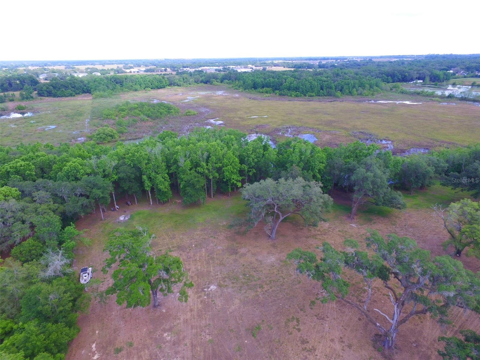 Beautiful, clean 10 acres ready for your homestead, farm, or what have you.  Property is adjacent to Dade City Hospital. Owner has currently partially fenced the property and is raising donkeys to keep the grass down. New well and electrical service on property.  AR zoning allows a variety of uses. East side of property has lake front exposure.  Owner may consider trades or financing.