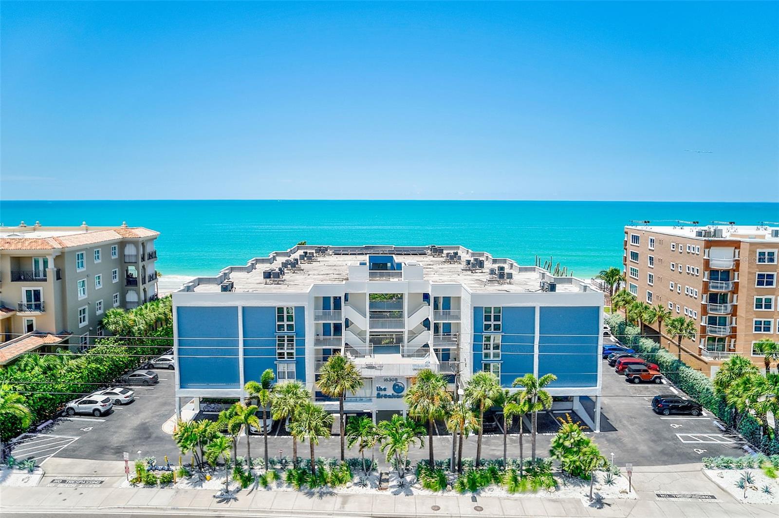 Welcome to Gulf-front living at its finest in this beautifully remodeled 2-bedroom, 2-bathroom condo in the heart of Redington Beach Tucked within an intimate building of just 38 units. This residence delivers direct Gulf of Mexico views, breathtaking sunsets, and the soothing rhythm of the waves right outside your door.

The remodeled kitchen showcases classic shaker cabinetry, quartz countertops, and stainless steel appliances, with uninterrupted sightlines flowing across the living and dining areas with views of the beach. The spacious primary suite is a true retreat, featuring a dramatic floor-to-ceiling picture window and sliding glass doors that open to the balcony for endless beach views. A generous walk-in closet and a brand new en-suite bath—complete with double vanity, ample storage, and a seamless walk-in shower—complete the sanctuary. The guest bedroom and bath have been tastefully updated as well.

Added conveniences include a private laundry room with full-size washer and dryer just outside your front door, plus extra storage for beach chairs and gear. Resort-style amenities elevate the lifestyle, with a beachfront heated pool, BBQ grills, and abundant seating for sunset cookouts and lazy poolside afternoons.

Steps from Redington Beach Town Park and minutes from dining, shopping, and entertainment, this location offers tranquil beachfront living with easy access to St. Pete Beach, Clearwater, and Tampa International Airport. With excellent income potential in a 30-day minimum rental building, it's perfect as a primary residence, vacation getaway, or investment. Schedule your private showing and claim your slice of Gulf Coast paradise today.