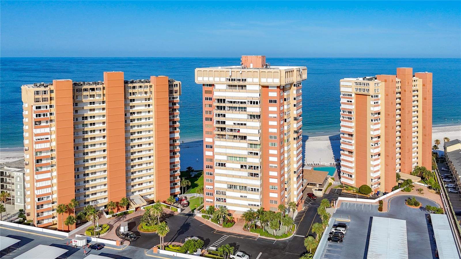 HUGE PRICE IMPROVMENT!  Redington Towers II #1208 – Coastal Living with Stunning Intracoastal Views.  Situated on the on the 12th floor, this beautifully maintained 1-bedroom, 1.5-bath condo offers breathtaking sunrise and Intracoastal water views that set the tone for true Florida coastal living. Fully furnished and move-in ready, this residence features an open floor plan with a spacious living and dining area, complemented by a large kitchen with breakfast bar—perfect for entertaining or casual dining. The generously sized primary suite includes a queen beds, a walk-in closet, and a private ensuite bath, while a convenient half bath provides added comfort for guests. Step outside to the expansive 26-foot balcony and enjoy morning coffee with dolphin sightings or unwind with evening breezes and ever-changing water views. This unit also includes covered parking (Space #54) and additional storage on the 21st floor.  Redington Towers II is a gated, resort-style beachfront community offering 24-hour guard security and an impressive array of amenities. Enjoy direct beach access, a heated gulf-front pool, fitness center, and a large clubhouse currently undergoing renovations and sure to be spectacular when complete. Residents also enjoy a variety of activities and social events, along with billiards, ping pong, a library, and outdoor grilling areas. Additional conveniences include bike, kayak, and paddleboard storage, as well as on-site EV charging stations.  Located directly across from Del Bello Park with picnic areas, a fishing dock, and water access, and just minutes from shopping, dining, and entertainment. Easy access to Madeira Beach, Indian Rocks Beach, and vibrant downtown St. Petersburg.  Milestone inspection and Structural Integrity Reserve Study have been completed, with strong reserves and a well-managed association. Condo fees include cable, internet, water, sewer, trash, security, and exterior maintenance.  Whether you're searching for a full-time residence, seasonal retreat or investment opportunity (3-month minimum rentals), this condo offers the perfect blend of comfort, convenience, and coastal charm.  Experience the best of beachfront living at Redington Towers II.  Please note, Redington Towers II is a no pet building.