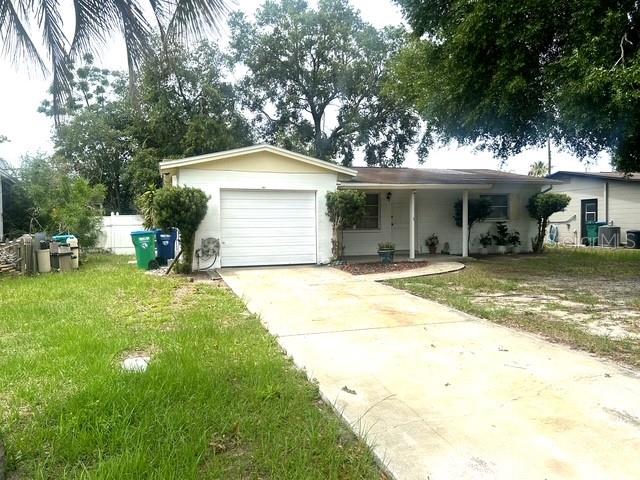 **NEW ROOF GOING ON SOON** Charming 2-bedroom, 1-bath home ideally located just minutes from the beautiful Gulf beaches and the shopping, dining, and entertainment options at Seminole City Center. This home features ceramic tile flooring throughout the living areas and comfortable carpeting in the bedrooms. The spacious family room opens directly to the backyard, creating a great space for relaxing or entertaining. Enjoy morning coffee on the covered front porch overlooking this attractive neighborhood. Outside, you'll find a fenced yard with a nice-sized backyard offering plenty of room for pets, play, or gardening. Additional features include a 1-car garage with laundry hookups and ample storage space. Whether you're looking for a primary residence, vacation home, or investment property, this home's convenient location and practical layout make it a must-see.