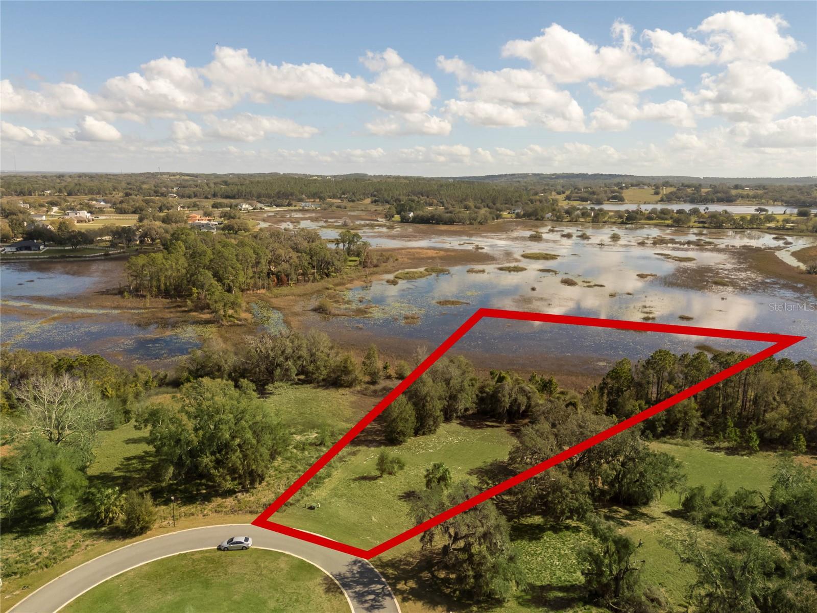 Elevate your expectations with this premier 2.83-acre estate lot—a crown jewel within the beautiful, 24-hour gated enclave of Blue Spring Reserve. Offering a rare blend of high-altitude views and absolute seclusion, this is more than just a homesite; it is a front-row seat to Florida’s natural splendor. This lot is situated at the back and on cul-de-sac of this one street community. Featuring the highest elevation in the development, sitting 20' above the wetlands. The pie shape of the lot has no rear neighbors with the nearest house to the back of the property is approximately 1/2 mile, creating the upmost privacy. Blue Spring Reserve is an intimate community of only 63 homesites, designed in harmony with a one-of-a-kind 300-acre nature preserve and protected Sandhill crane nesting grounds. Blue Spring Reserve is conveniently located only 1 mile from turnpike, exit #285 on SR 19N. Easy access to the turnpike allows for a 35 min drive to Orlando. As one of the final buildable lots in this sought-after community, this property represents a vanishing chance to build a custom masterpiece in a true ecological preserve. Do not miss this opportunity!