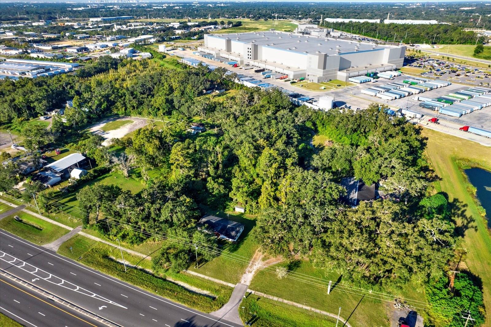 One or more photo(s) has been virtually staged. Be neighbors with AMAZON! Commercial potential in one of TAMPA’S fastest-growing corridors. This 3 bedroom, 2 bath home sits on nearly ½ acre with the potential to assemble surrounding parcels for over 1 acre total. Located right next to Amazon’s major fulfillment center, this property offers an incredible opportunity for INVESTORS, DEVELOPERS, or BUSINESS OWNERS looking to capitalize on the area’s rapid commercial expansion. Currently zoned RSC-6, the surrounding properties have already been approved and rezoned for COMMERCIAL USE, making this site a prime candidate for future commercial conversion. Built in 2000 and well maintained, this spacious home offers approximately 1,584 sq ft of living space with a split bedroom floor plan, large kitchen, and open living areas. Recent updates include a NEWER ROOF (6 years old), BRAND-NEW A/C, and fresh paint and carpet. The home also features a large backyard, ample parking, and room for storage or expansion. Enjoy NO HOA or CDD fees and a prime location with direct access to US-301, I-75, I-4, Hard Rock Casino, Tampa Executive Airport, and Temple Terrace Industrial Park. Live here now, rent it out for income, or hold and rezone for commercial use later. This is your chance to create wealth, build equity, and own a piece of Tampa’s next commercial frontier. Opportunities like this don’t last long — act fast!