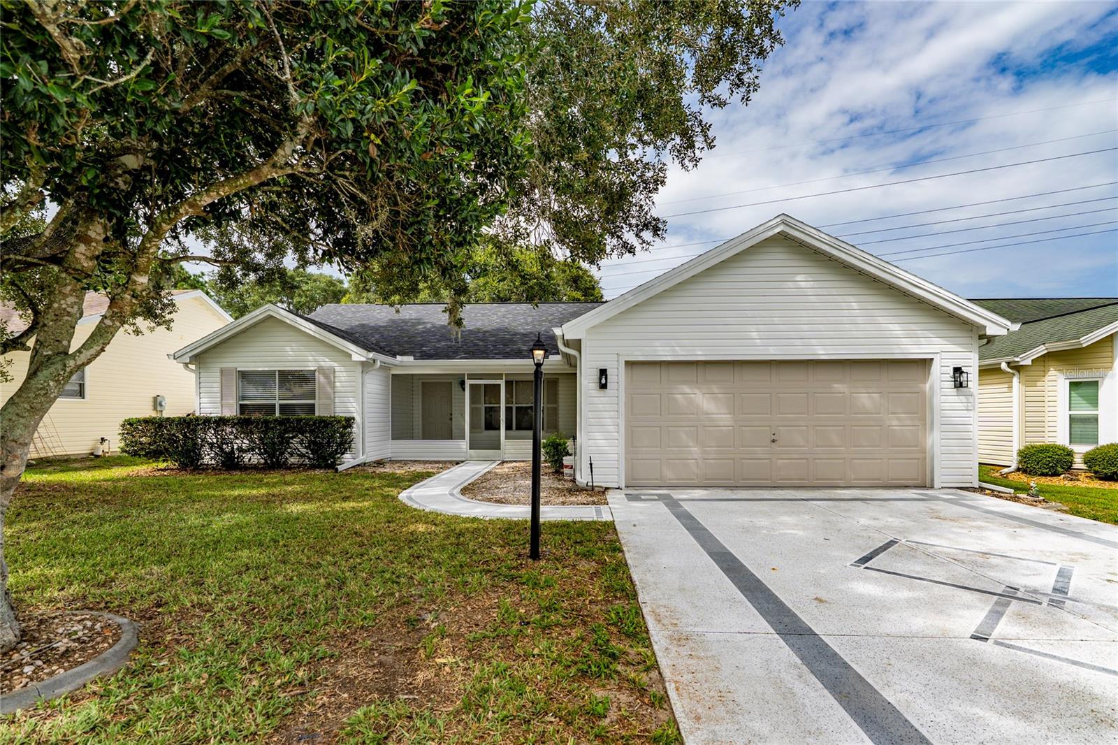 ** More photos soon.** Welcome to effortless Florida living in this beautifully renovated 3-bedroom, 2-bath pool home located in the desirable Village Rio Grande  in The Villages. Offering approximately 1,392 square feet of comfortable living space, this move-in-ready residence has been thoughtfully updated inside and out plus Brand new Water Heater.
Major improvements include a NEW ROOF in 2026, fresh interior and exterior paint, new stainless steel kitchen appliances, a beautifully remodeled kitchen, and two renovated bathrooms featuring stylish tile showers. Ceramic tile and luxury vinyl plank flooring provide an attractive, durable, and low-maintenance finish throughout the home.
The property also features a spacious 2-car garage and a 2-car driveway, providing plenty of parking and storage space. Step outside to your own private Florida retreat, complete with a beautifully updated swimming pool and screened pool enclosure—perfect for relaxing, entertaining guests, or enjoying the Florida sunshine year-round.
Conveniently located near golf courses, recreation centers, shopping, dining, medical facilities, and the entertainment of Spanish Springs Town Square and Lake Sumter Landing Market Square, this home offers the location and lifestyle that make The Villages so special.
With the major updates already completed, all that is left to do is move in and enjoy. Schedule your private showing today and make this beautifully renovated pool home yours before someone else does!