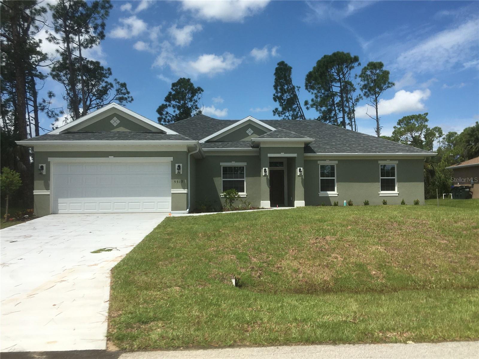 MOVE IN READY!!  NEW CONSTRUCTION!!!  Home has 4 bedrooms, 2 bath, an open/split floor plan with 9"4" ceilings throughout.  Kitchen has all wood soft close cabinets with center Island.  Granite countertops throughout.  There is a separate laundry room with counter and cabinet space located between the kitchen and 2 car garage.  The kitchen opens into the great room with sliders to the back lanai.  Separate dining room.  The Primary bedroom has dual closets on each side of the hallway which leads from the bedroom to the bathroom which boasts a walk in shower, garden tub and dual sinks.  A private toilet is located in a separate water closet.  The other 3 bedrooms are all spacious rooms with hallway and a full bath.
 Home is on CITY WATER.