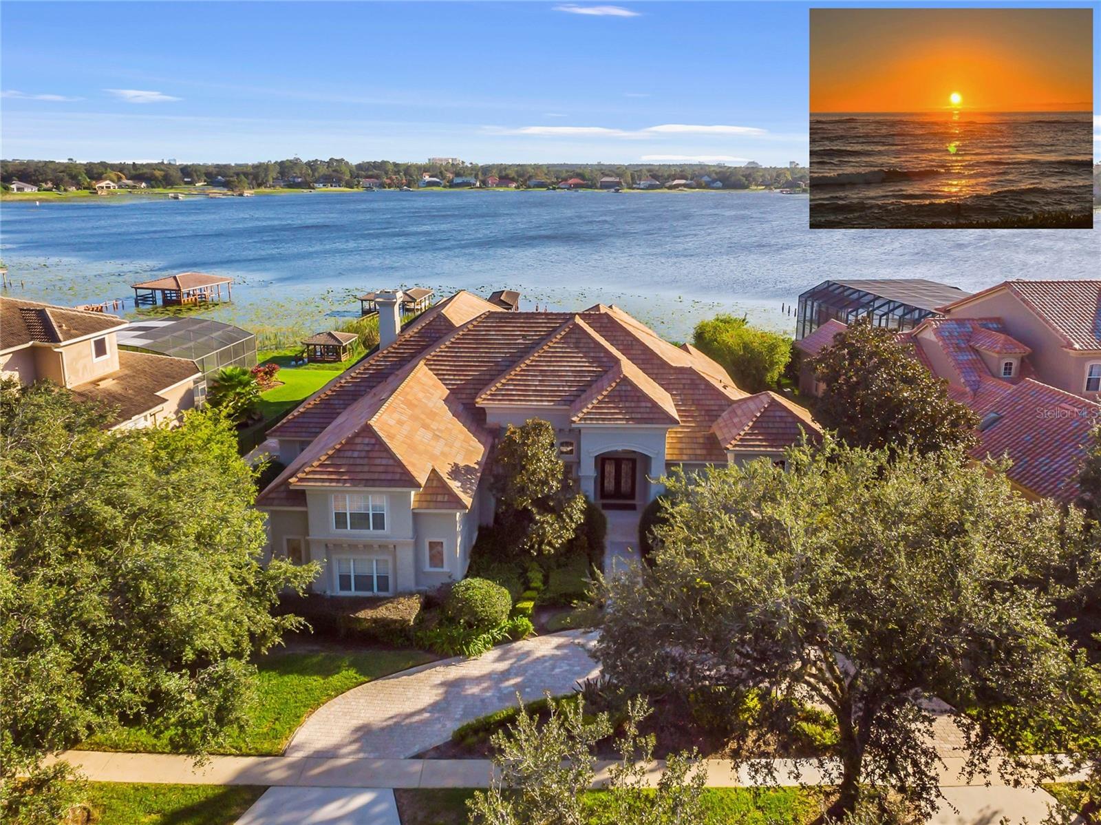 WOW! SPECTACULAR LAKEFRONT WITH AMAZING SUNSET VIEW. 6-7 BEDROOM 6 FULL BATH HOME PLUS 2 HALF BATHS, ENTERTAINMENT ROOM. (EACH BEDROOM HAS IT'S OWN BATH) BOAT DOCK. EVERYTHING UPSCALE. CUSTOM BUILDER REMODELED THE INTERIOR WITH ADDITIONAL NEW FEATURES SPENDING OVER $1.4 MILLION CLOSE TO 6800 SQ. FT. / 8275. 24 HOUR GATED AND GUARDED COMMUNITY. Interior walls stripped and re-done including electrical, plumbing, floors, air conditioning, automated lighting systems and security surveillance cameras in and out. EXTENDED BONUS ROOM UPSTAIRS. All modern upscale craftmanship and rich details, state of the art, completed 2018. Must see Master bathroom with 2 STORY HIS & HER CLOSET. MARBLE SLAB WALLS (NO GROUT), OVERSIZED MASTER SITTING AREA. Molding and Niches throughout. All living areas have 34x34 inch MARBLE TILE FLOORS. This home includes a GOURMET KITCHEN with updated Island, exotic GRANITE COUNTERTOPS and MARBLE Floors. All steel appliances, double oven, GAS STOVE, pantry, and elegant cabinets. HUGE FAMILY ROOM with AMAZING LAKE VIEWS! Master, Office, and additional 3 Bedrooms downstairs also an Entertainment Room with WOOD FLOORS, updated wall cabinets, molding, and plantation shutters. ALL TV AND DVD MUSIC SYSTEM INCLUDED. SURVELLIANCE CAMERAS IN AND OUT. SOARING CEILINGS AND BREATHTAKING VIEWS! Every room completed with CUSTOM CABINETRY, ELEGANT FAMILY ROOM WITH MARBLE FIREPLACE, EXTRA LARGE OPEN LAKE VIEWS, and lighter paint color. 2 BEDROOMS UPSTAIRS COMBINED AS 2ND MASTER / INLAW SUITE WITH SMALL REFRIGERATOR, MICROWAVE AND SINK. 42x12 Bonus Room/Theater Room/ 7th Bedroom. STUNNING EXTRA LARGE GAME ROOM ON FIRST FLOOR WITH BAR SET UP, LAKE VIEWS & WOOD FLOORS. Indoor Laundry Room with Storage. 3 Car oversized side garage entry with CIRCULAR DRIVE. ADDITIONAL 2-3 CARS PARKING SPACES WITH FENCE GATE. Square footage provided by original builder plans. Extra Large RAISED BACK YARD with SEA WALL AND LANDSCAPE LIGHTING. DOCK RECENTLY UPDATED $50K, NEW A/C $20K. NEW LANDSCAPING. POOL & NEWER ELECTRIC HEATER FOR POOL + GAS HEATED SPA + KIDDY POOL. TRAVERTINE DECK AND GRANITE SUMMER KITCHEN. ENTIRE POOL AREA WAS DEMOLISHED AND TOTALLY REBUILT. SEA WALL and ONE OF A KIND SEE THROUGH GLASS FENCED YARD, NO OTHER HOME IN THIS AREA HAS A GLASS FENCE (SEE THROUGH YARD AND LAKE.) IRON FENCE ON BOTH SIDES. LOW WATER BILLS water pump from lake for irrigation. Mosquito repellent in back for pool and porch. Orlando’s most exclusive 24 Hour Gated and Guarded Community with boat dock, small park, playground, tennis, and basketball courts. Estates at Phillips Landing – Dr. Phillips area, with the best of everything! THIS UNIQUE INTERIOR DESIGNED HOME is comparable to no other home in the area, took many years to complete update with County and HOA Permit. USED AS A SECOND HOME, AND MAINTAINED BY CARETAKERS. Close to “Restaurant Row”, 25 min. to International Airport, Disney World and EPCOT. Close to Sea World, Universal Studios, Malls, Schools, Library, Trader Joes, Whole Foods & Fresh Market. ENJOY THE SUNSET. ENTERTAIN FAMILY & FRIENDS ON THE LARGEST OPEN PORCH ON LAKEFRONT!  YOU MUST SEE THIS HOME TO BELIEVE IT! MUST SHOW PROOF OF FUNDS. SELLER MAY CONSIDER OWNER FINANCING. HARD TO FIND A HOUSE LIKE THIS ONE!