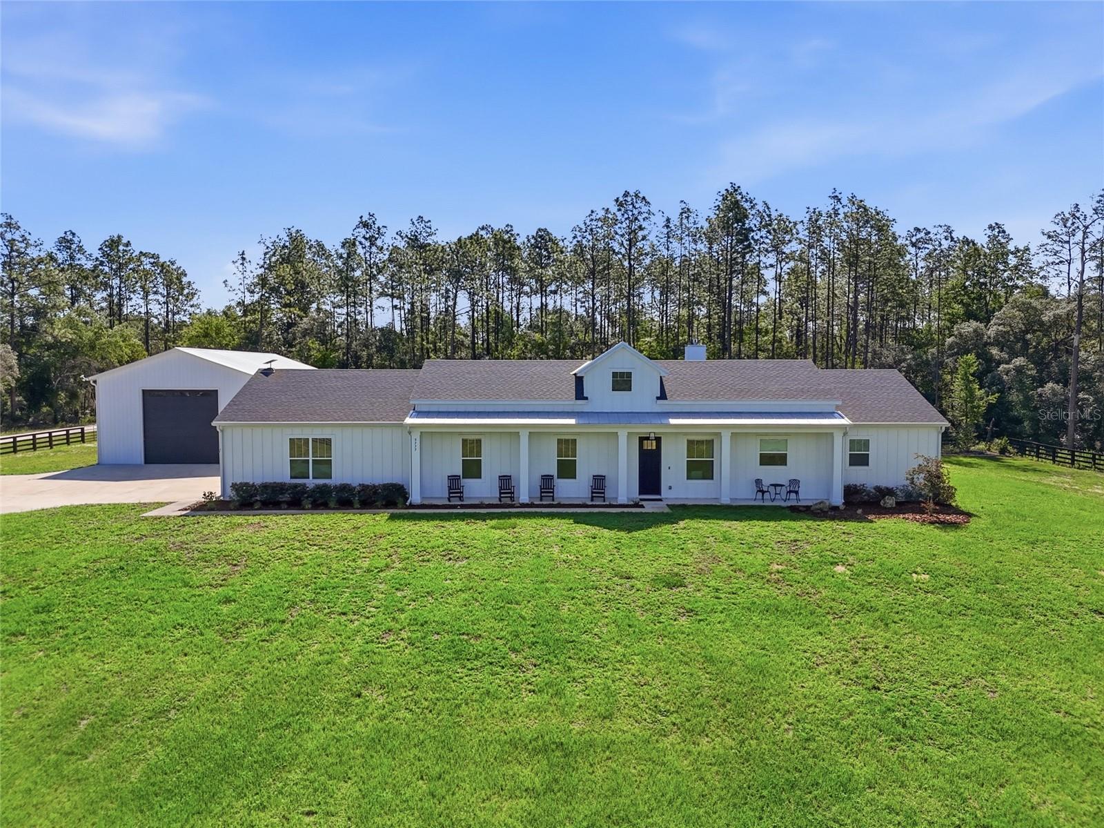 If you're looking for a home that truly has it all, this is the property for you. Whether you're a business owner, a hobbyist, or someone with a toy collection that needs serious space, the utility here is unmatched. There is a 30x50 metal building with 100-amp electric service, full RV hookup, and a large asphalt parking area behind it. Two separately gated entrances provide pull-through access onto nearly 2 acres of fully fenced land in Rolling Hills, on a corner lot — just 15 minutes from the World Equestrian Center.

The backyard features a screened-in patio, a Jacuzzi-brand hot tub, a locally made custom chicken coop, and an outdoor bar, all set on beautiful pavers. When the sun goes down, the side of the metal building can become a massive outdoor movie screen, perfect for entertaining friends and family. This is the property where holidays are hosted and memories are made without ever leaving your home.
This 2023 build offers 4 bedrooms, 3 bathrooms, a 3-car garage, and 2,288 square feet. The open floor plan centers around a large kitchen island with bar seating, flowing naturally into the living and dining areas anchored by a gas fireplace.

Custom interior lighting, a gas range, tile throughout, and Pottery Barn curtains and rods enhance this home’s thoughtful design. The primary suite features a custom-built walk-in closet, soaking tub, walk-in shower, and dual vanities. 

Additional features include a whole-home Generac generator, a tankless gas water heater, and an electric, remote-operated entrance gate — all contributing to a property clearly built and maintained with intention. The listing agent is related to the seller.