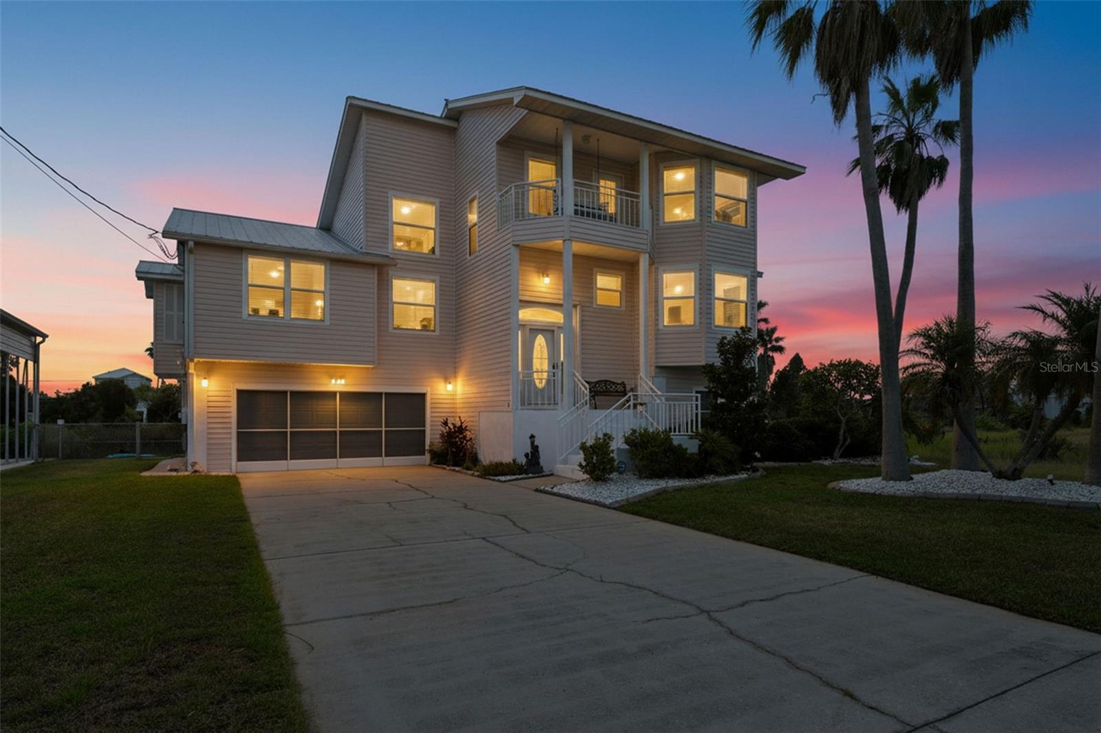 DOUBLE LOT!! STUNNING, UPGRADED and MOVE-IN READY with AMAZING GULF VIEWS!!! The one thing you can NOT add to your home is a VIEW of the Gulf...you have to have the LOCATION!! This one has the LOCATION!! ** 3-STORY Waterfront Home with UNOBSTRUCTED GULF VIEWS with DOUBLE LOT + 170 feet of water frontage + on the cul-de-sac with in-direct GULF ACCESS and NO HOA!!! ** 3 bedrooms + BONUS ROOM on the 3rd floor with GULF VIEWS can be a 4th bedroom, office/den, gym or guest space + 2.5 bathrooms + OPEN FLOOR PLAN with water views from EVERY window + 2-stories of LARGE balconies/lanais for EXTRA OUTDOOR LIVING SPACE + third floor front balcony with porch swing to enjoy your nightly sunsets together in the evenings with a glass of wine + 2-Car Garage (large deep enough to hold 2 cars plus a golf cart, large truck, or boat/trailer) + LARGE NEW CARPORT (30x45) for extra parking space for your RV with full hookup or boat and trailer!! Plus, there is a lot of space downstairs in the home for entertaining family and friends (just add a pool table!) + Reinforced Metal Roof to last a lifetime was just certified in 2022!! NEW AC 2021!! NEW Anderson Windows with triple pane, hurricane impact glass installed in the home in 2013!! NEW Hot Water Heater 2021!! New waterproof plank flooring!! House is fully wired for a generator + prewired for an RV hookup, future pool, or hot tub!! Large pantry and inside laundry room on main floor where all the bedrooms are at!! Hidden safes The home has an impressive 2-Story Grand Entrance with two story ceilings and windows that make this home feel VERY spacious, light, bright, and cheery!! Not every home has 2 story ceilings to give you that incredible sense of space!! The master suite is also on the main floor for convenience + long driveway for extra parking and beautiful curb appeal + the yard is completely fenced-in + room to add a pool + concrete seawall + LARGE concrete patio space by the clear water's edge which is large and deep enough to have an outdoor sectional, loungers, and outdoor dining set (most of the homes don't have this!!) + Palm Trees and Lush Landscaping!! STUNNING long distance views that you don't get from single level homes or even two-story homes...and VIEWS OF THE GULF OF AMERICA that you don't get from just any home or location!!  Huge home with 2,210 sq ft of living space; 4,694 total!! PLUS...you have a TREMENDOUS amount of outdoor living space with the 2 extra LARGE balconies/lanai areas!! The main level balcony is COVERED and screened-in and large enough to enjoy the space outside!!  The kitchen is OPEN to the large great room and the dining room!! The main living floor...offers all BRAND NEW Luxury Vinyl Plank Flooring throughout!! The kitchen is remodeled with Quartz countertops + a large breakfast bar for extra seating!! Newer stainless steel appliances!! Beautiful dining room!! The second bathroom is remodeled with matching Quartz countertops. The main balcony is screened-in...so enjoy that beautiful Florida weather and breeze!!  Windows everywhere to let in the natural light!  The bottom level is a blank canvas to create your favorite space...a gym, an entertainment game room, a workshop, an incredible storage area!! It's complete with a 1/2 bath for home-owner convenience! Enjoy fishing, kayaking, paddle boarding, and boating right from your backyard and floating dock!! Easily go through the boat lift to get out to the Gulf of America!!