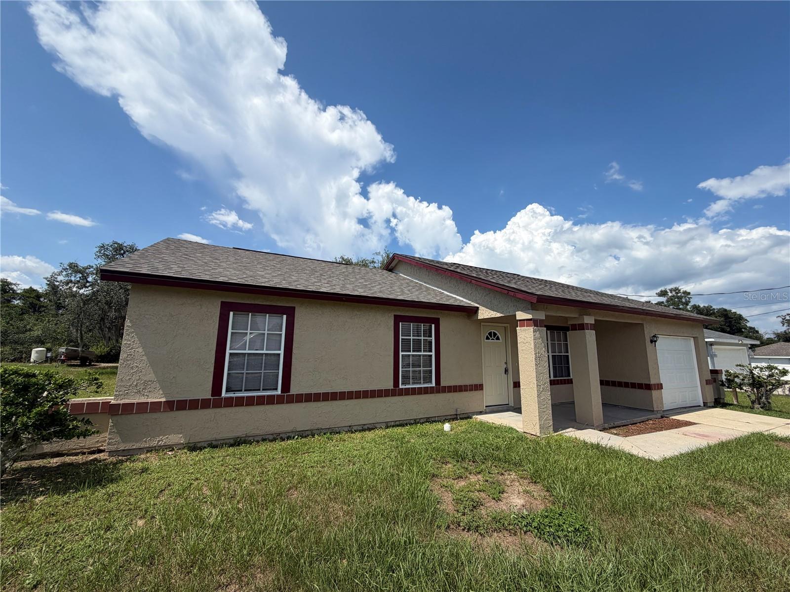 3/2 Home Silver Springs Shores South in Ocala, FL offers a practical layout with three bedrooms and two bathrooms. The home features vaulted ceilings, a covered front porch, and an open back patio. Interior updates include ceramic/porcelain tile flooring throughout living areas, carpet in the bedrooms, shaker-style kitchen cabinets, and granite-look Formica countertops. Appliances include a refrigerator and range/oven, dishwasher, and the one-car garage has a garage door opener plus laundry hook-ups. Important systems and finishes were refreshed in 2026: a new roof, full interior paint, and new exterior paint. The property uses well and septic, permits small pets, and is designated No Smoking.
** Ask us about our security deposit plan** **Residents are enrolled in the Resident Benefits Package (RBP) for $39.95/month which includes renters insurance, HVAC air filter delivery (for applicable properties), credit building to help boost your credit score with timely rent payments, $1M Identity Protection, move-in concierge service making utility connection and home service setup a breeze during your move-in, our best-in-class resident rewards program, and much more! More details upon application. **