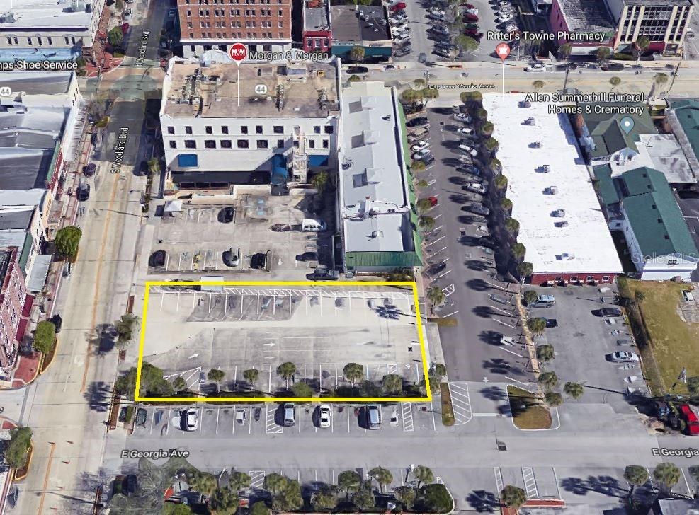 Prime commercial parcel in the center of historic downtown DeLand.  Practically at the corner of "Main and Main," this property represents a rare opportunity for development in the heart of DeLand's award winning downtown core.  This parcel is zoned "C-2A DOWNTOWN COMMERCIAL DISTRICT" which allows for a myriad of potential uses and development options.  Parcel is surrounded by retail, professional offices, as well as substantial public parking.  Multiple mixed residential/commercial projects have either been recently built or are in the approval stages in downtown DeLand, and none are as close to the center of downtown as this parcel.  Parcel is completely paved with concrete and is currently utilized as a parking lot under short term leases.  **All information believed to be correct, but Buyer shall be ultimately responsible for verification of all material facts**