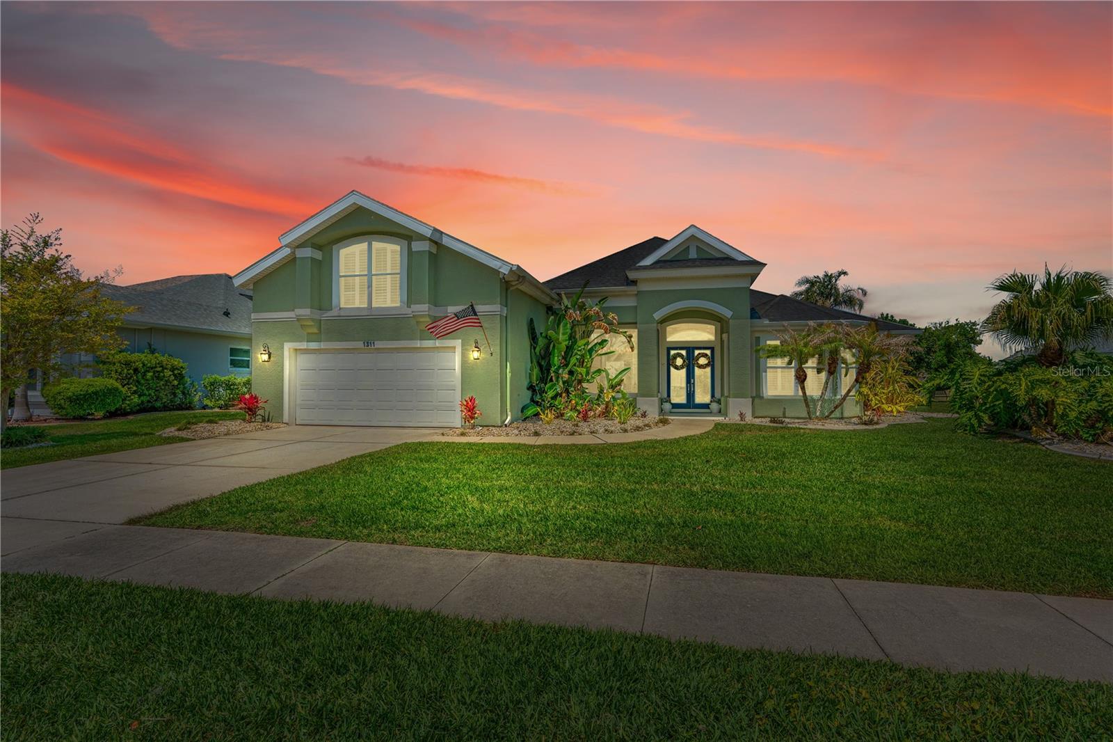 Welcome to 1311 Crepe Myrtle Lane, a stunning residence in the highly sought-after gated community of Sanctuary on Spruce Creek in Port Orange, Florida. This exceptional four-bedroom, four-bathroom POOL home with a dedicated office offers the perfect blend of elegance, comfort, and modern design. Step inside to an inviting open floor plan filled with an abundance of natural light, highlighted by soaring 12-foot ceilings throughout the main living areas and enhanced by beautiful luxury vinyl plank flooring. Throughout the home, you'll find thoughtful interior designer touches, including updated lighting fixtures, stunning accent walls, and gorgeous cohesive décor that elevate every space. The thoughtfully updated kitchen is a true centerpiece, featuring granite countertops, crisp white shaker cabinetry, stainless-steel appliances, large center island with extra storage and a wine refrigerator, and select display cabinets with interior lighting, and under-cabinet lighting, perfect for both everyday living and entertaining. The spacious layout flows seamlessly to the outdoor living area, where you'll find a private pool and lanai overlooking a serene community waterfront setting--ideal for relaxing or hosting guests. The master suite is generous in size and offers two large walk-in closets, both with custom shelving systems installed. Both guest bedrooms on the lower level also offer customer closet systems. Additional highlights include an oversized garage with ample space to comfortably accommodate two large vehicles, a golf cart, and plenty of extra storage. Garage measures 22' wide x 29' 7" deep, with an additional tandem space that measures 12' wide by 7' deep. The tandem space includes a storage closet for miscellaneous items. This absolutely stunning home offers refined living in one of Port Orange's premier communities--combining style, space, and a picturesque setting you won't want to miss. Located within the Spruce Creek High School zone and walking or bike ride distance to Cypress Creek Elementary and Creekside Middle School. A must see!