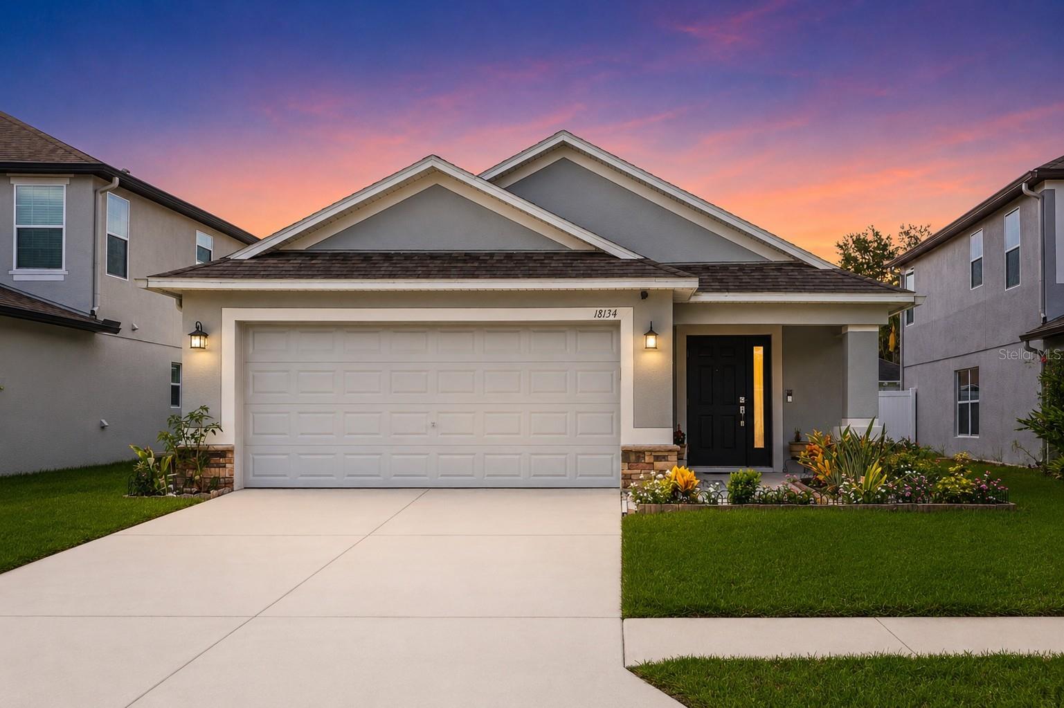 Welcome to the highly sought after Concord Station community! This beautifully maintained home showcases true pride of ownership from the moment you step inside. A thoughtful designed living space with an open concept floor plan greets you. The spacious kitchen is filled with abundant natural light, making it the perfect place to gather, entertain, or enjoy everyday living. Step outside to the extended screened-in patio, offering a private retreat for morning coffee, evening relaxation, or hosting family and friends year round. Located in one of Land O' Lakes' most desirable communities, this home combines comfort, style, and convenience with access to exceptional neighborhood amenities, top-rated schools, shopping, dining, and major commuter routes. Don't miss the opportunity to make 18134 Glastonbury Lane your next home!