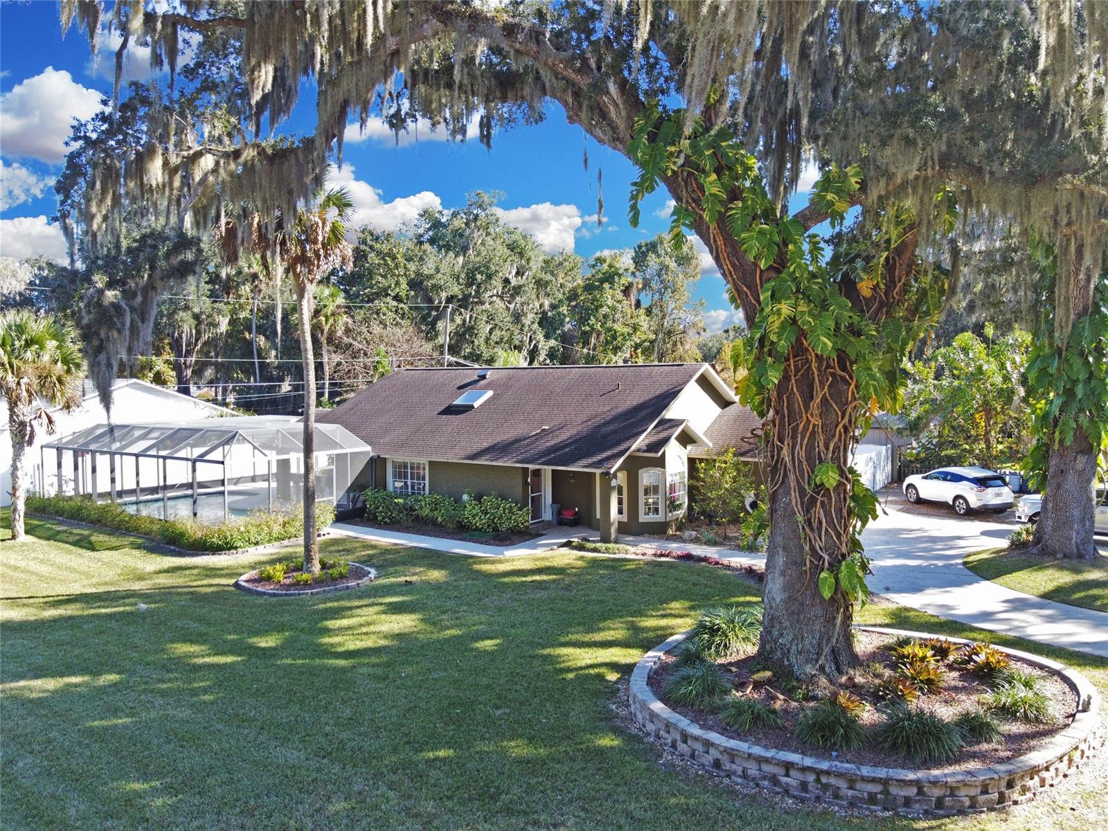 This custom home has it all!!
Large open floor plan with vaulted ceilings, sky lights and many large windows for extra brightness, spacious eat-in kitchen with breakfast bar and nook, many cabinets and counter space, SS appliances all leading to the laundry room, and 2 car garage.
Great room leads to the lanai and screened and solar heated pool with lots of added decking and an extra 20 x20 ' area with 6 person hot tub in covered pavilion for the total relaxation.
The home has three large bedrooms with double closets and 2 full baths recently remodeled. The bright and sunny master bath has garden tub, separate shower and double sinks.
French doors, custom blinds, and tile floors add to the warmth  of this home.
This amazing home has tons of curb appeal with its custom paint, circular driveway surrounded by lush oak trees on extra large corner lot with vinyl fencing , double gate entrance to extra parking for RVS, boats and all the Toys with 2 large sheds for storage, one with power and shelves perfect for a man cave.
Space enough for everyone's needs and privacy all located on a quiet street with no HOA.
A must see!!!!!
BACK UP OFFERS WELCOMED! ;Water: City