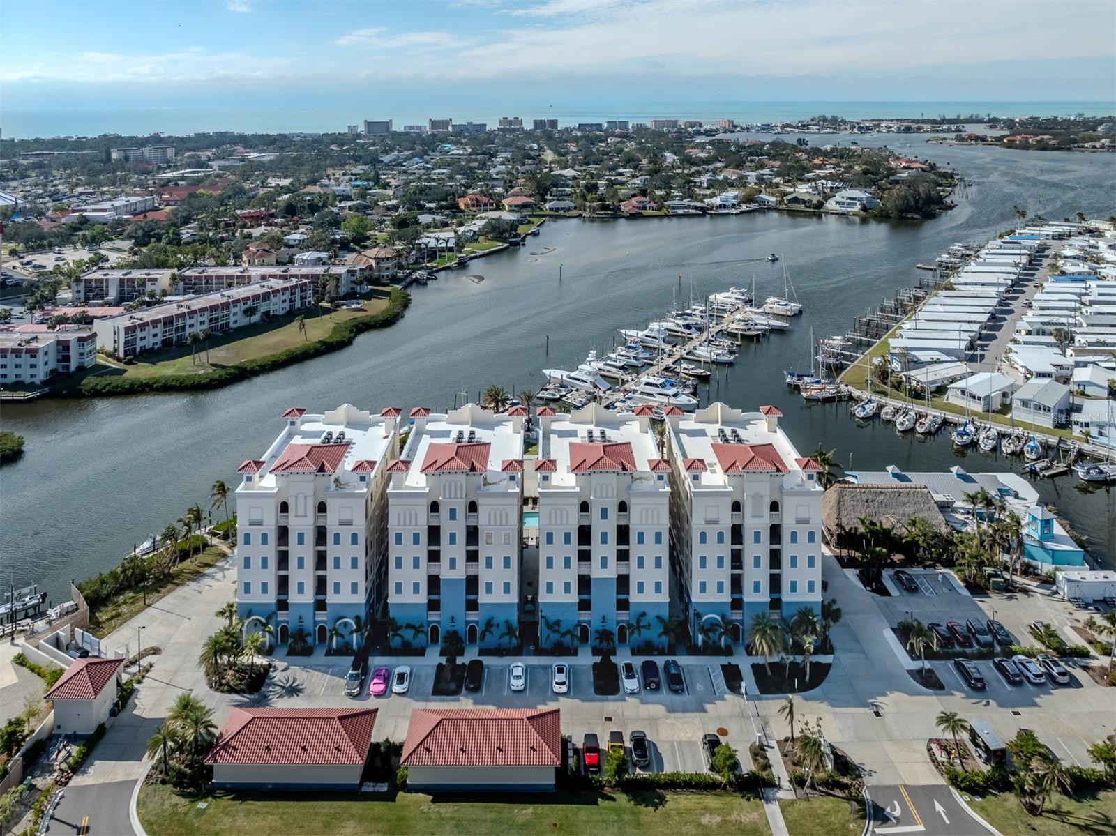 Welcome to The Jewel of Porto Vista! Nestled in the exclusive waterfront community of Porto Vista, this modern 5th-floor condo boasts breathtaking Intracoastal and Roberts Bay water views. Built in 2023, it features upgraded appliances, solar screens on the lanai, stylish cabinets, and luxurious flooring throughout. Enjoy the best of coastal living with plenty of natural light, an open and airy layout, and gorgeous sunsets from your own home. The condo is part of a gated community with top-notch amenities, including security, a heated community pool, and a private garage. Guests will love the added convenience of private guest parking. Next door, indulge in fine dining at Dockside Waterfront Grill or explore the Fisherman's Wharf Marina, offering flexible boat slip leasing, boat rentals, fishing, and kayaking adventures. Porto Vista is ideally located near historic Venice Avenue, Venice Beach, and the Legacy Bike Trail. Plus, it’s just a short walk to the charming downtown Venice, with its unique shops, dining spots, entertainment, and vibrant nightlife. This is coastal luxury at its finest—don’t miss out on this rare opportunity!