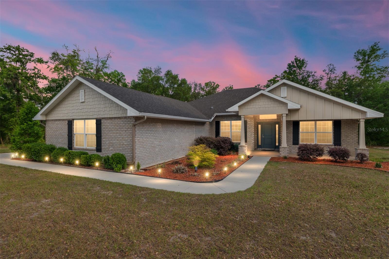 Escape the noise without giving up convenience—this is North Central Florida living at its best.
Just 25 minutes from NW Gainesville, tucked just over the Gilchrist County line (hello, lower taxes), you’ll find the sought-after Woods of Alchrist community—where space, privacy, and nature come standard. Built in 2021, this thoughtfully designed home sits on an expansive 4.8-acre lot, offering the perfect blend of cleared land for everyday living and wooded surroundings for peace and privacy.
Start your mornings with deer grazing and wild turkeys wandering through your yard—this is the kind of tranquility you can’t manufacture.
Inside, the home features an open-concept layout ideal for both relaxing and entertaining. Natural light pours through tall windows, filling the living spaces with warmth. You’ll find 4 spacious bedrooms, a dedicated home office, and a 3 way split layout that balances comfort with functionality. The home and owner's suite boast stunning wood look tile, while the remaining 3 bedrooms have carpet.  The kitchen has ample granite counter space and is open to both the dining room and the breakfast nook.  There is a comfortable seating for 4 at the bar, so the cook will never be left out of the fun!
The 3-car side-entry AIRCONDITIONED garage provides plenty of room for vehicles, tools, and all your outdoor toys—because with this much land, you’ll want them.
Lovingly and lightly lived in by just one owner, this home still feels fresh, modern, and ready for its next chapter.
If you’ve been searching for space, serenity, and smart value just outside Gainesville—this is it.