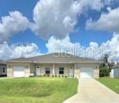 Virtually Staged. PRICED TO SELL.... Live Like You're on Vacation — and Earn While You Do!!! Welcome to this beautifully built duplex in Port Charlotte, perfectly positioned just 7 miles from Manasota Key beaches, 6 miles from the Port Charlotte Town Center Mall, and under 10 miles to Englewood Beach. This stylish new construction offers the ultimate blend of modern comfort and investment potential. Enjoy steady income from both units with existing tenants, we've taken away the hassle of you finding your own. Each side features spacious open-concept living, sleek finishes, private garages, and waiting for your touch to make it your own. The location offers easy access to shopping, dining, golf, marinas, and Florida’s famous Gulf Coast sunsets. Pack your picnic basket and have dinner while you watch the sun sink in the western sky. This income-generating property, is a vacation-style retreat, for both tenants. This duplex lets your tenants live, relax, and enjoy the area while you profit, as they live in paradise.