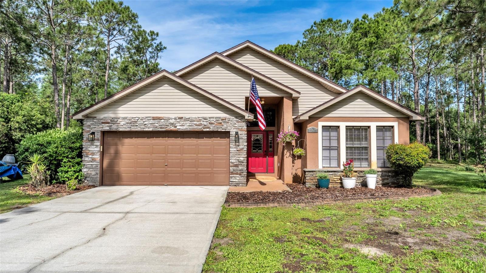 Welcome to your own private country retreat offering two separate parcels totaling approximately 2.3 acres, providing added flexibility and the potential opportunity to build on the second lot. Nestled in a serene setting surrounded by nature, this property offers the perfect blend of peaceful living and everyday convenience, just minutes from US-27, I-4, shopping, medical facilities, Champions Gate, Disney World, and Central Florida’s world-famous theme parks. From the moment you arrive, you’ll appreciate the extended driveway and welcoming entry highlighted by a beautiful stained-glass front door and matching windows. Step inside to a stunning tile foyer with decorative medallion detailing that immediately showcases the home’s character and charm. Cathedral ceilings create an open, airy atmosphere throughout the home, while tile flooring flows through the main living areas, kitchen, and bathrooms, with comfortable carpet in the bedrooms. The kitchen with its GRANITE countertops, decorative backsplash, double ovens, and a Unadose chlorination filtration system, make it ideal for entertaining, holiday gatherings, or everyday living. The inviting layout and eat in bar offers both comfort and functionality, creating a warm space for gathering with family and friends. The spacious primary suite serves as a true retreat, featuring a large walk-in closet and private water closet for added comfort and privacy. The en-suite bath includes GRANITE countertops, a fully tiled shower, and a relaxing jacuzzi tub positioned within the bedroom suite to create a spa-like atmosphere. Enjoy your screened-in pool and relax on the back porch with the convenience of an automatic awning, creating the perfect setting to enjoy Florida afternoons while overlooking the peaceful surroundings filled with abundant birds and local wildlife. The beautifully maintained grounds feature an irrigation system, extended driveway, and plenty of room for RVs, recreational vehicles, trailers, or additional equipment, complete with a convenient RV hookup already in place. Recent updates and additional features include: NEW roof (2026), NEW hot water heater (2026), AC replaced in 202 with UV light system, Pool pump replaced in 2020, pool screens replaced approximately 10 months ago, pest control service twice yearly, 500-gallon propane tank with approximately 65 galls of remaining gas, Generator included (needs pad and reconnection), new hot water heater (2026), Ac replaced in 2020 with UV light system. If you’ve been searching for privacy, functionality, and room to breathe without sacrificing convenience, this exceptional property is a must-see.