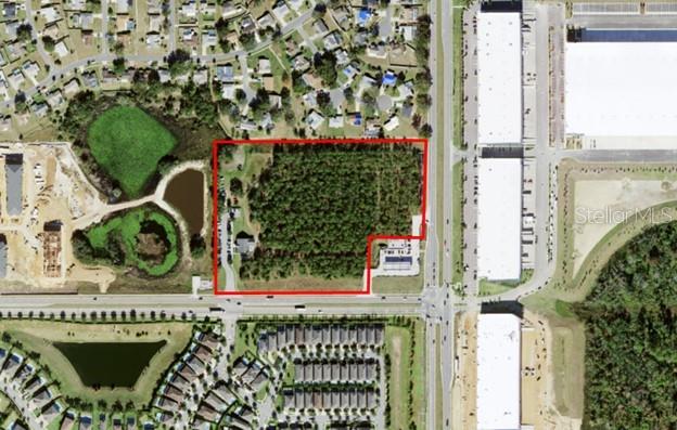 This is a unique opportunity to own prime acreage in the Four Corners area. Located in the northwest quadrant of the intersection of Sinclair Road and Lake Wilson Road, this property has 700 feet frontage on Sinclair Road and 350 feet frontage on Lake Wilson Road. The property is currently in use as a recreational ropes course attraction. This is a land offering only and the business does not convey. The Future Land Use for the property is Tourist Commercial making it ideal for retail commercial, mixed use, or multi-family residential.