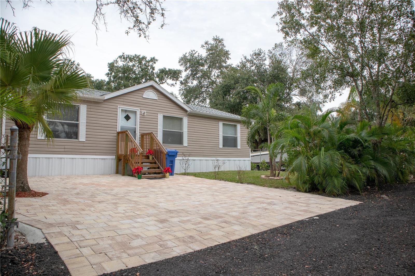 Exceptional opportunity in one of Tampa’s most versatile and rapidly developing areas! Situated on a rare double corner lot just ½ mile from Tampa International Airport, this unique property offers incredible flexibility for both residential and business use. Currently zoned AI (Agricultural Industrial), it allows you to enjoy the property as a private residence, operate a business, or explore future redevelopment opportunities. Many surrounding properties have already been rezoned to Manufacturing (M), making this an outstanding investment with significant upside potential.
The property features a 2-bedroom, 2-bath manufactured home with central A/C, well water, and septic system. In addition, you’ll find an impressive 1,650 sq. ft. detached garage/workshop and an 850 sq. ft. storage shed, providing abundant space for equipment, vehicles, inventory, or hobbies.
Positioned on a fully developed double lot with three 24-foot right-of-way and access from both sides of the block, this property offers exceptional accessibility and functionality. Whether you’re an investor, business owner, contractor, or someone looking for a property with unmatched flexibility and future potential, this is a truly one-of-a-kind opportunity in a prime Tampa location. Don’t miss your chance to own a property with endless possibilities!